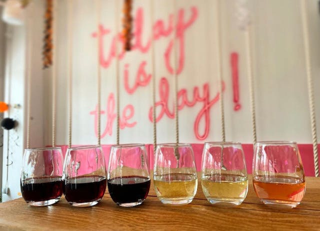 a glass of wine on a table