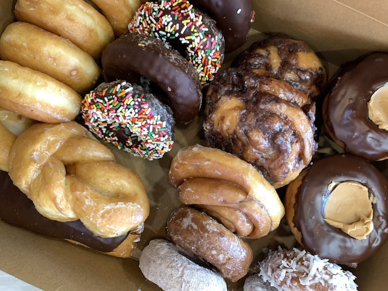 a box filled with different kinds of donuts
