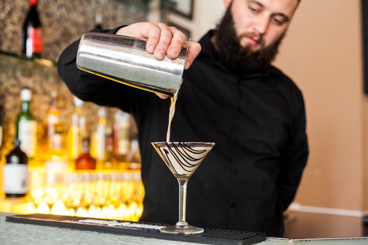 bartender pouring chocolat cocktail