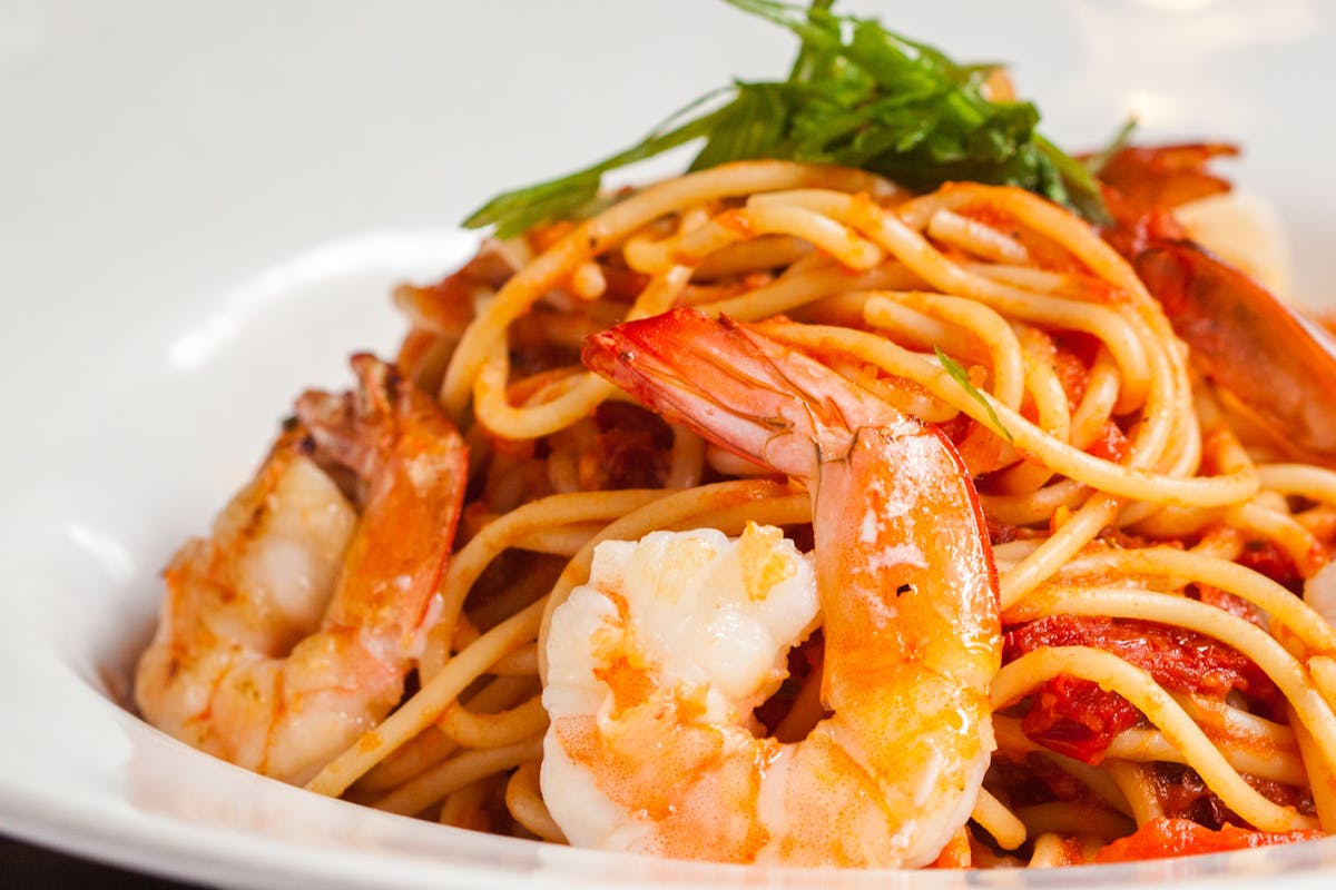 a plate of spaghetti and shrimp