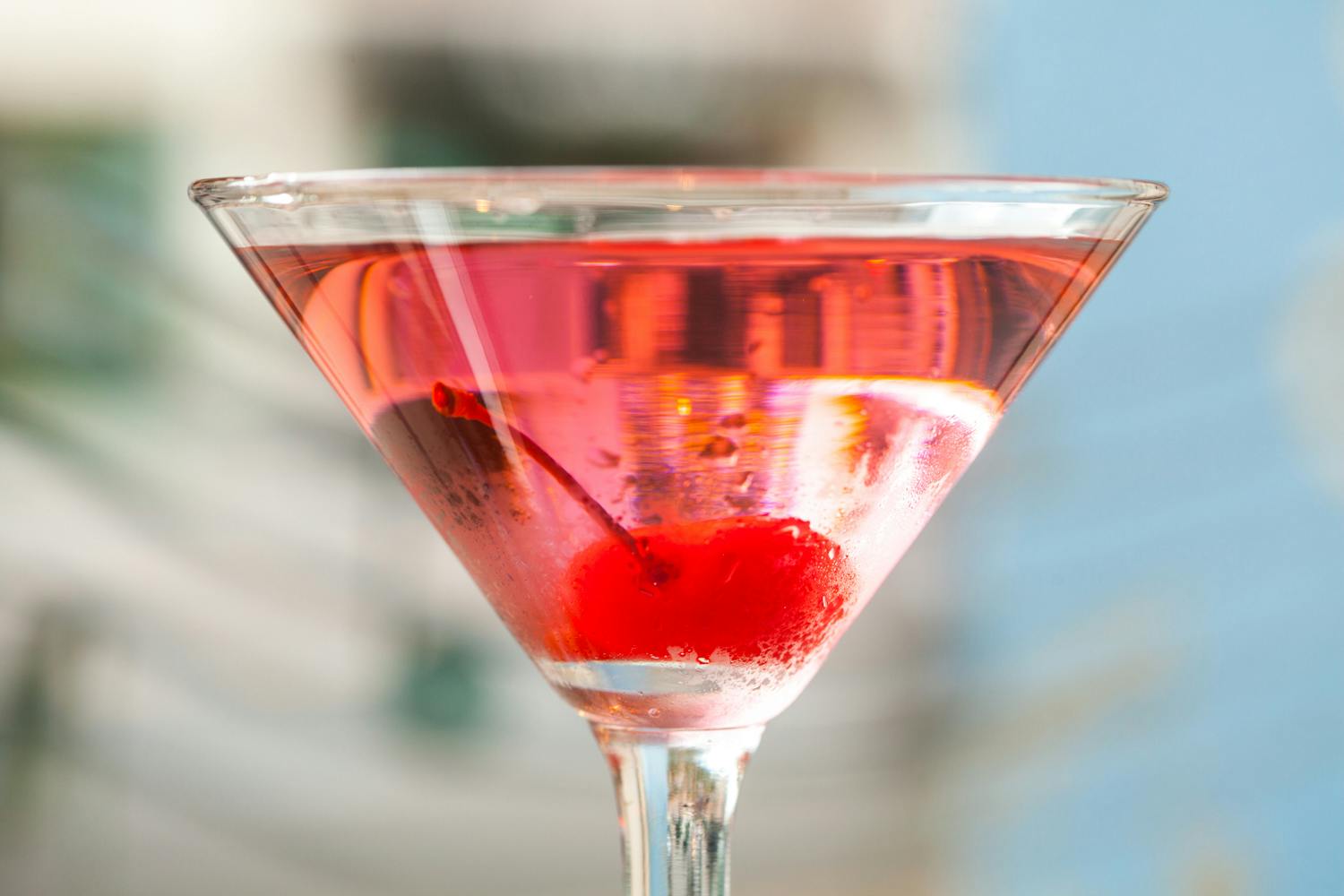 fruity summer cocktail with a cherry