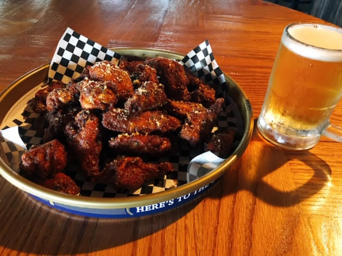 a plate of food sitting on top of a wooden table