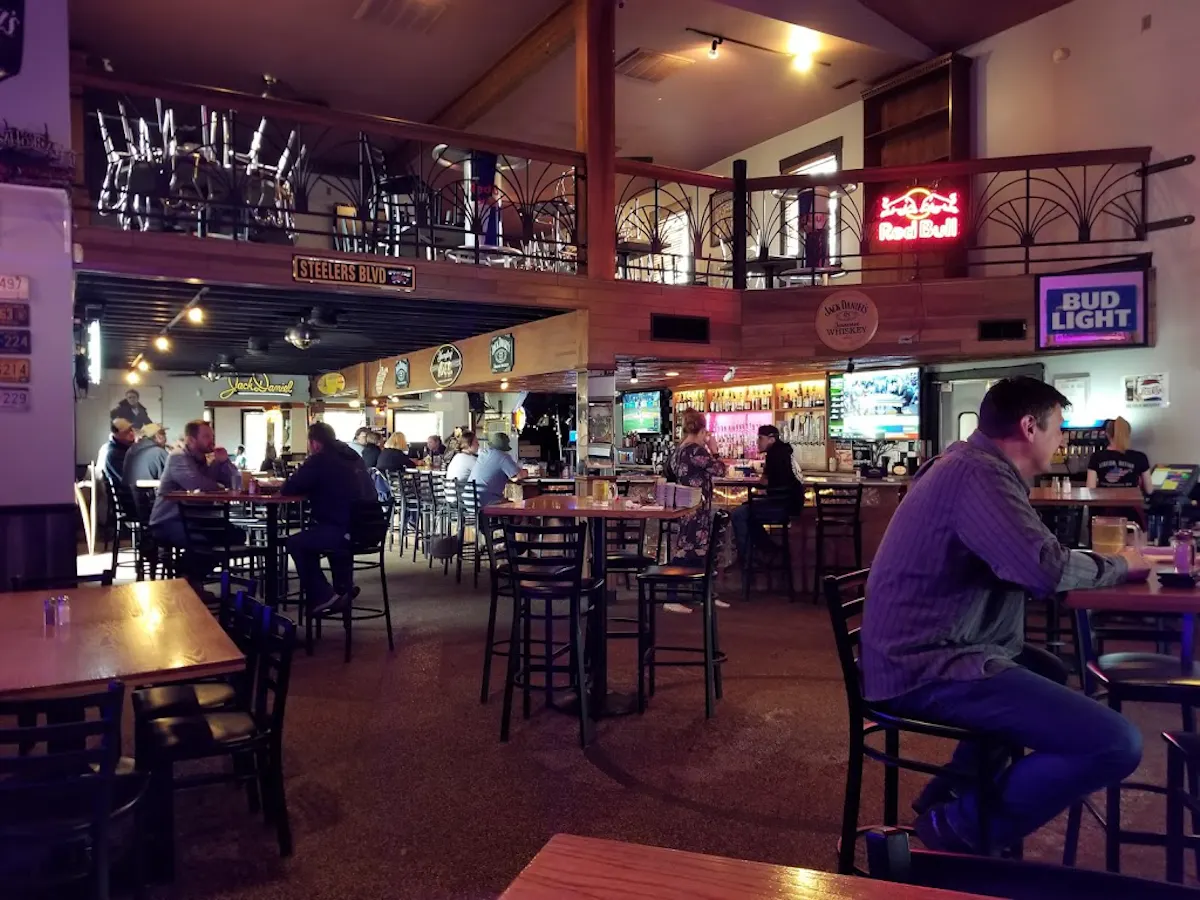 a group of people sitting at a table in a restaurant
