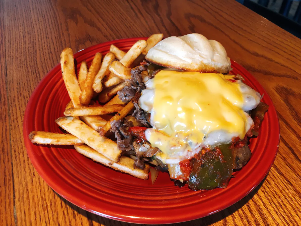 a plate of food sitting on top of a wooden table