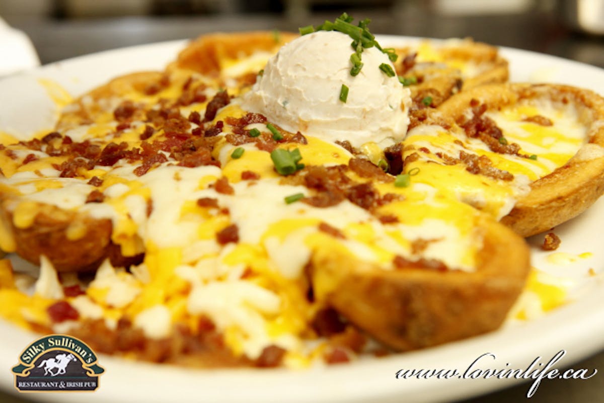 a close up of a plate of food with a slice of pizza