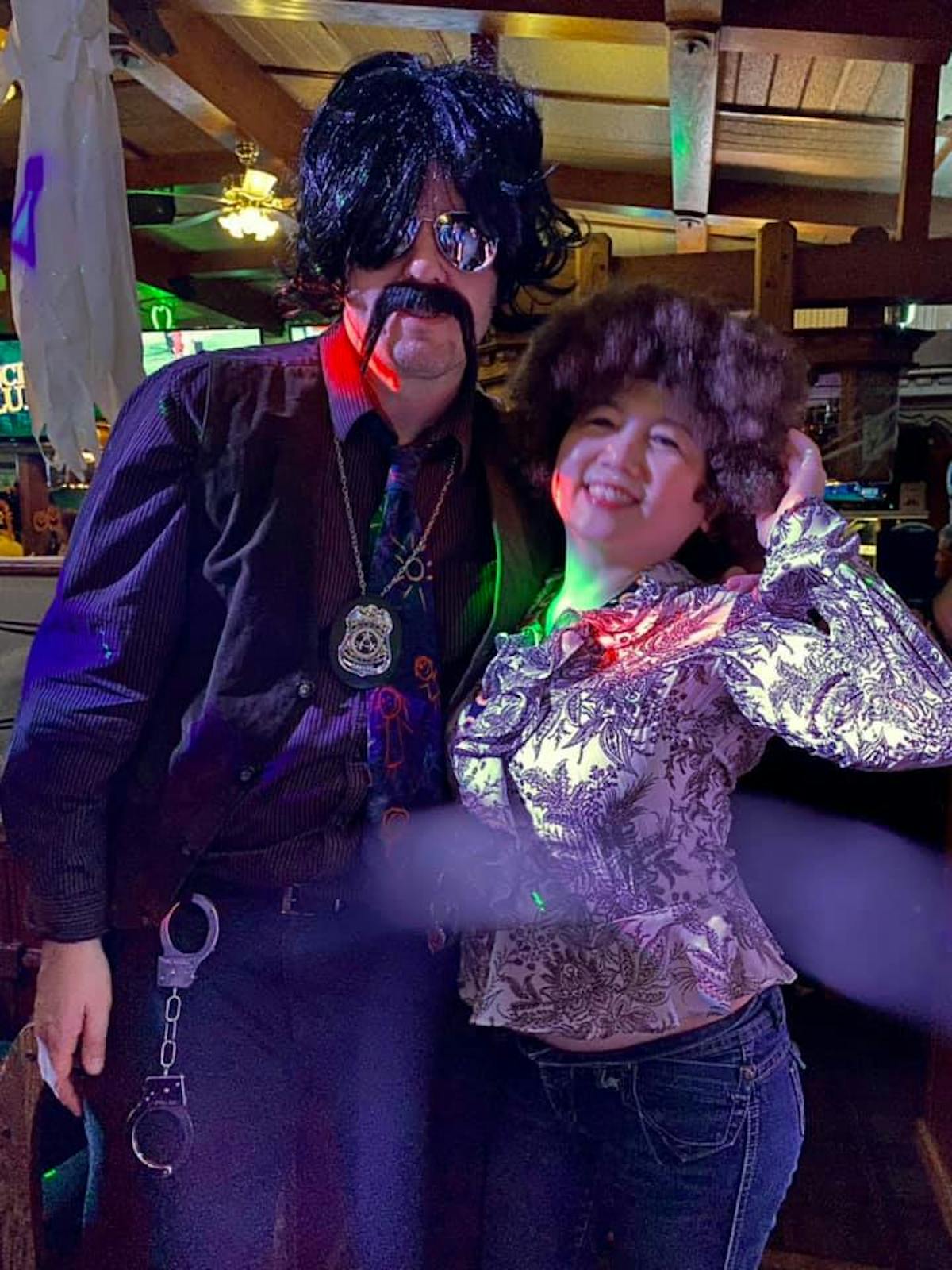 a man and a woman looking at the camera