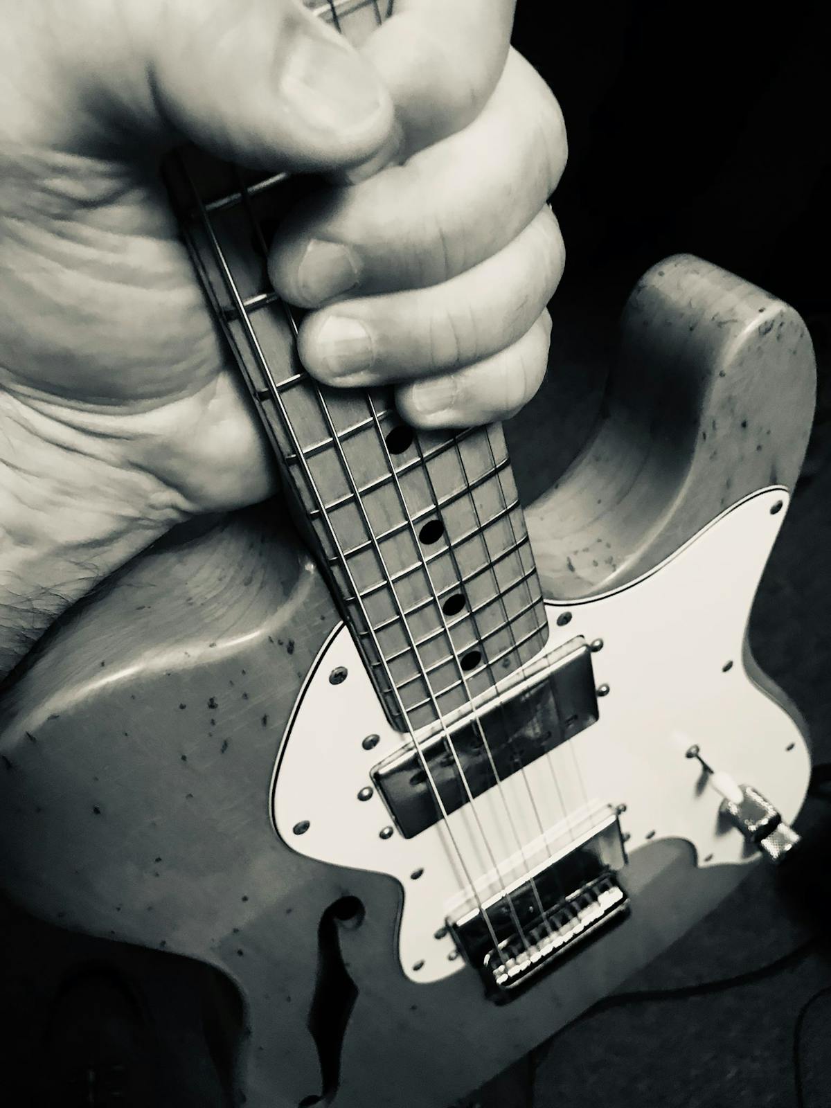 a person holding a guitar