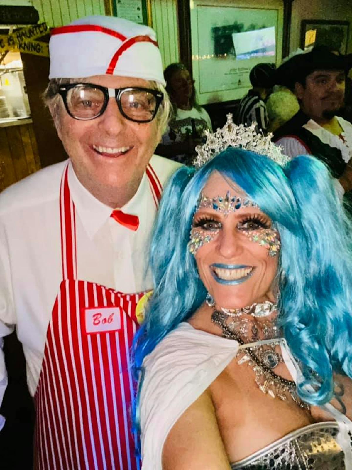 a man and a woman wearing a hat