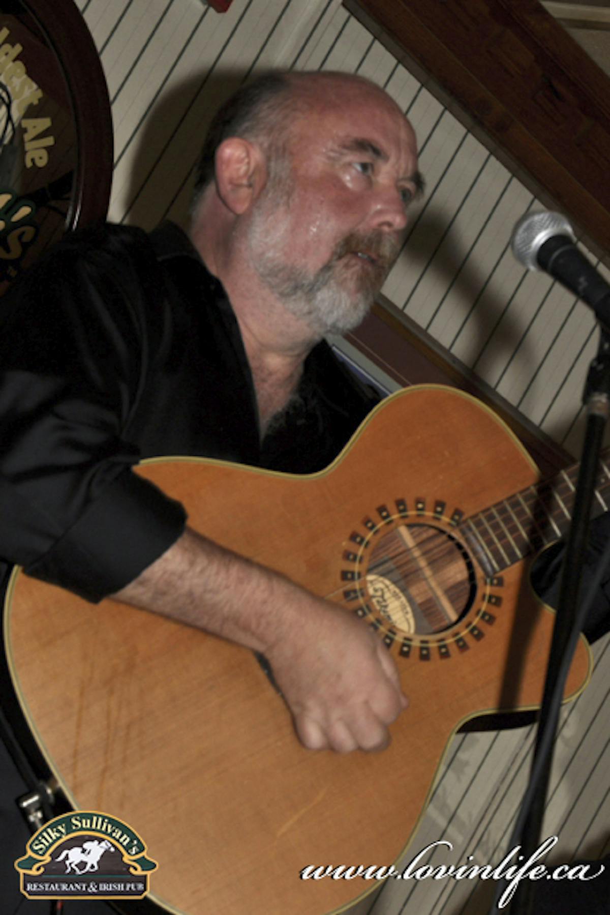 a man holding a guitar