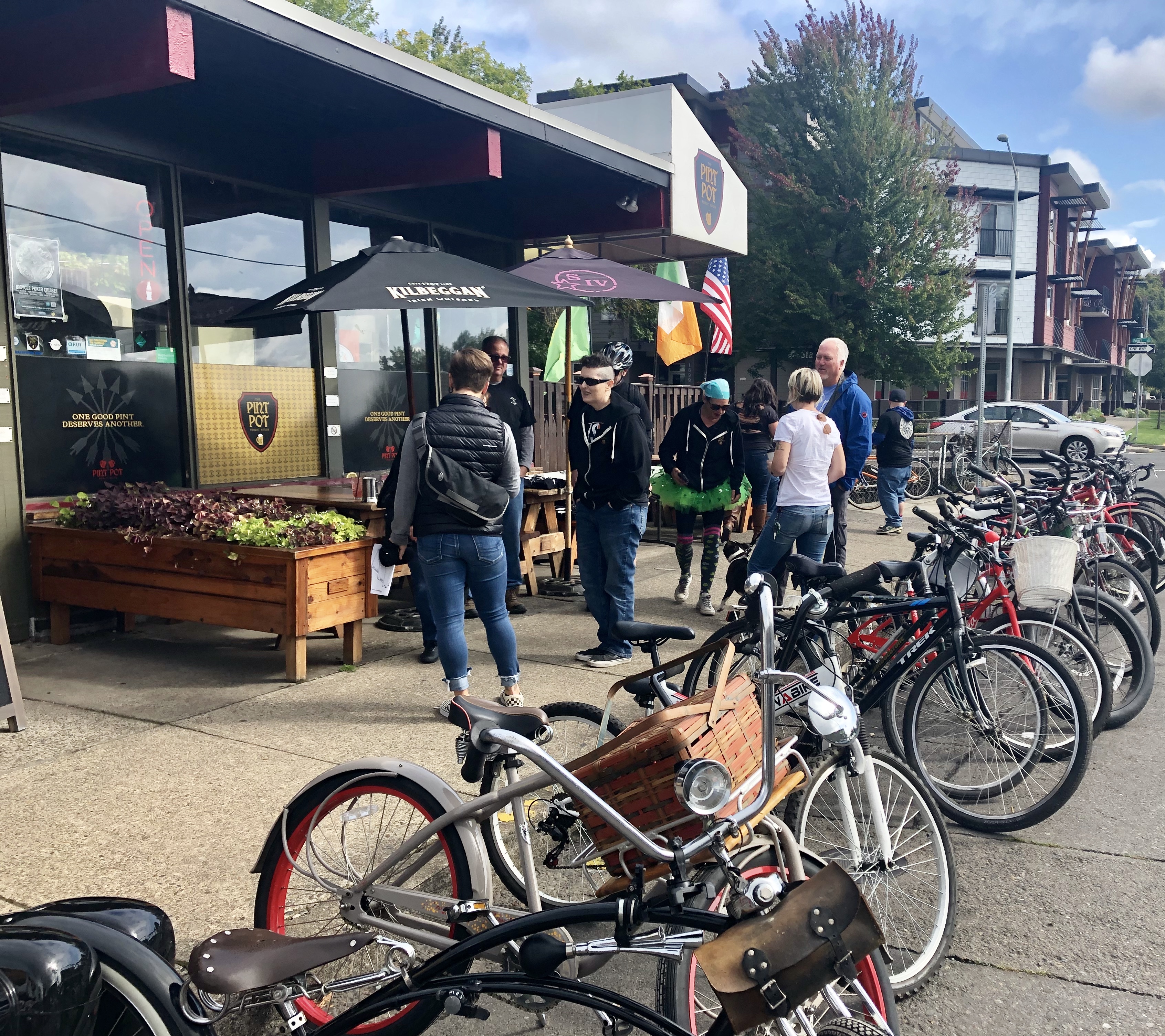 a group of people standing next to a bicycle