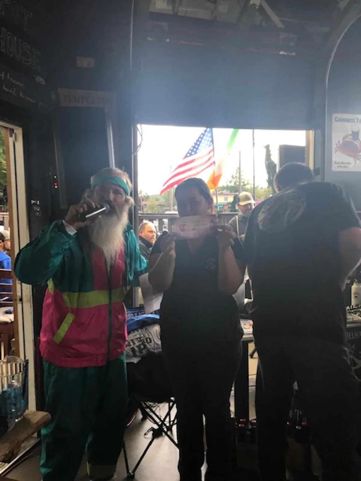 a group of people standing in front of a store