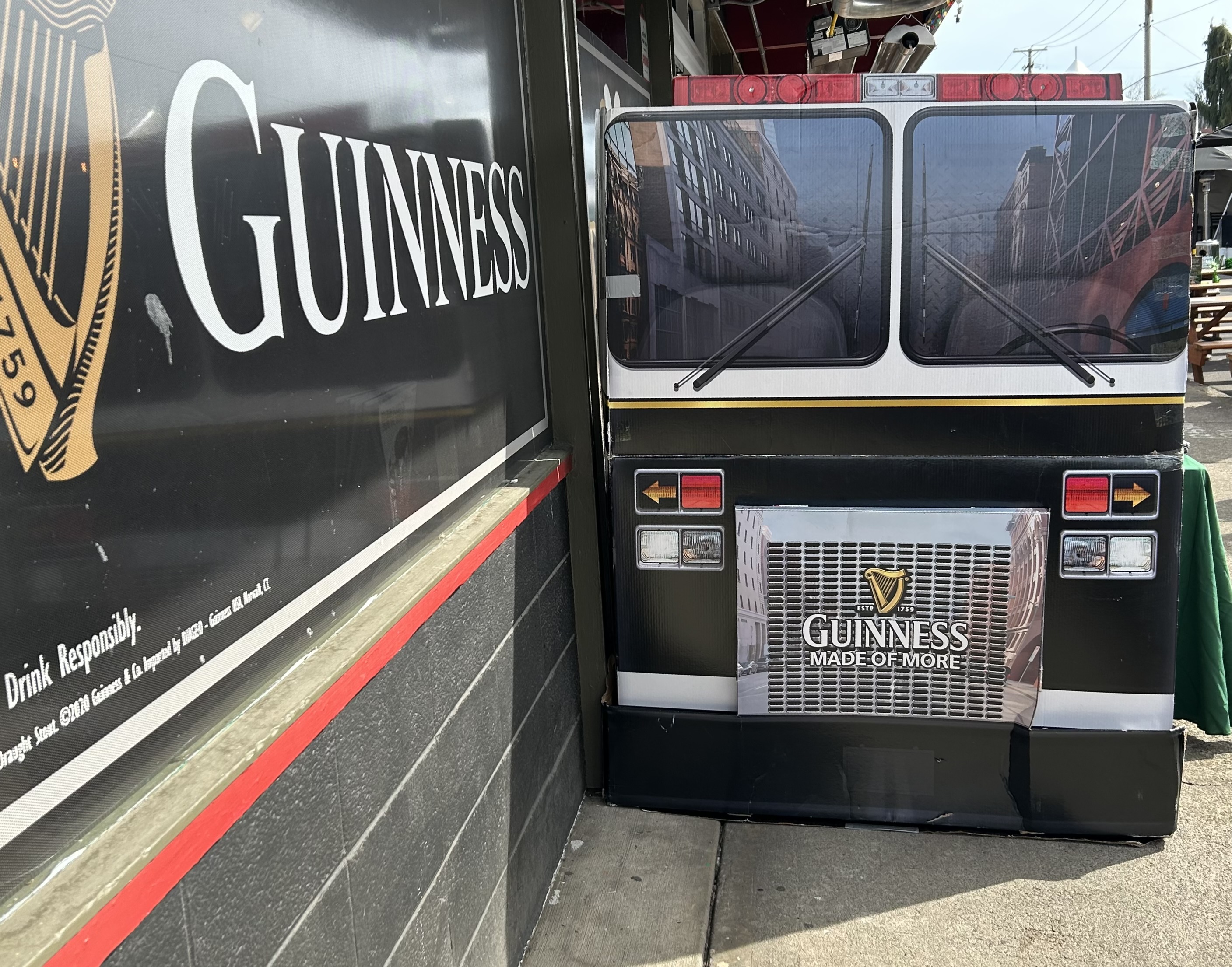 a bus parked in front of a sign