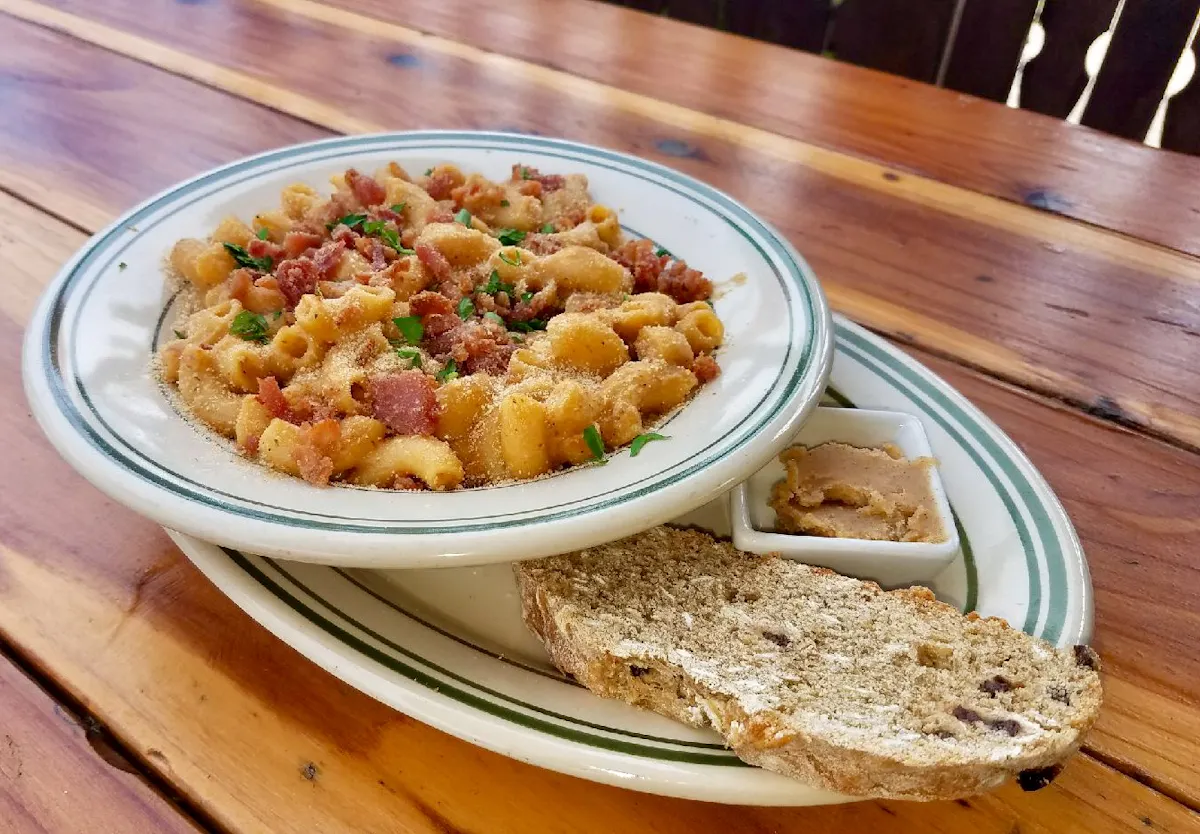 a plate of food sitting on top of a wooden table
