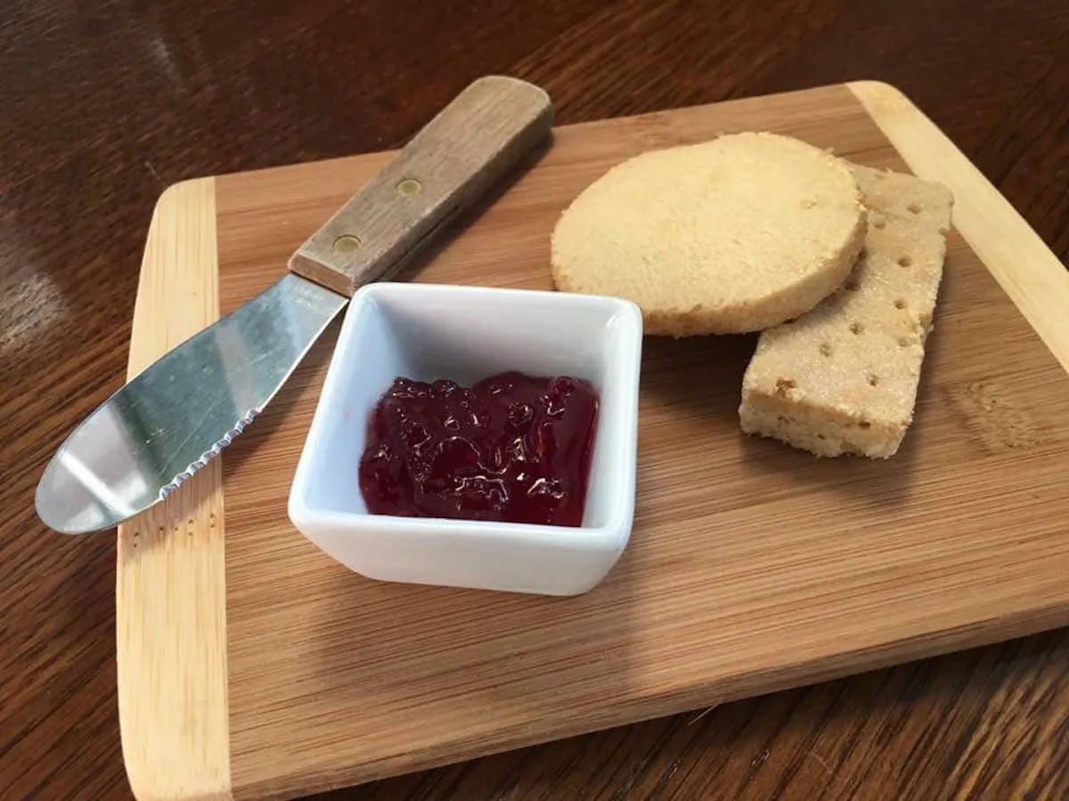 a piece of bread on a wooden cutting board