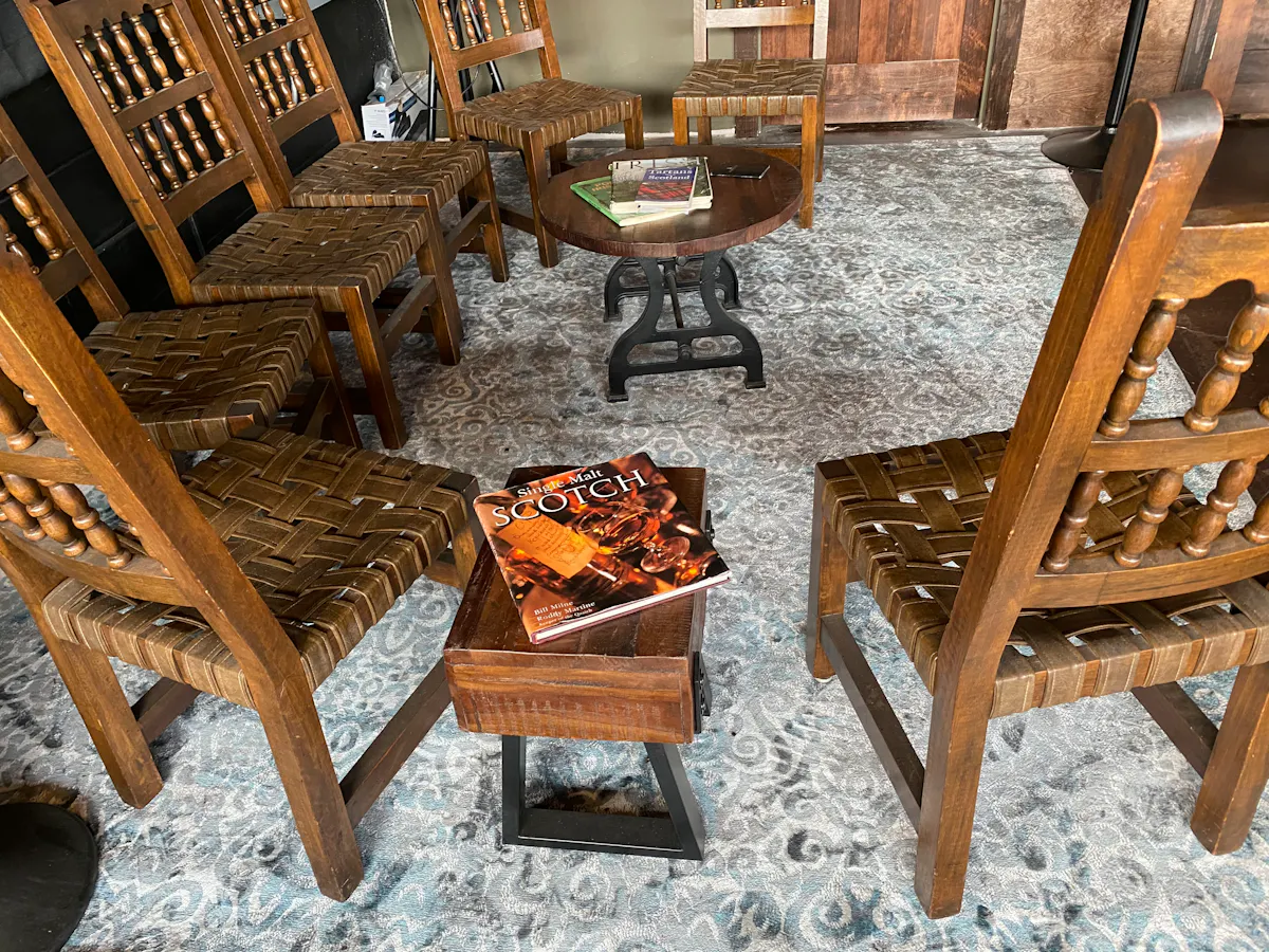 a wooden bench sitting next to a dining room table
