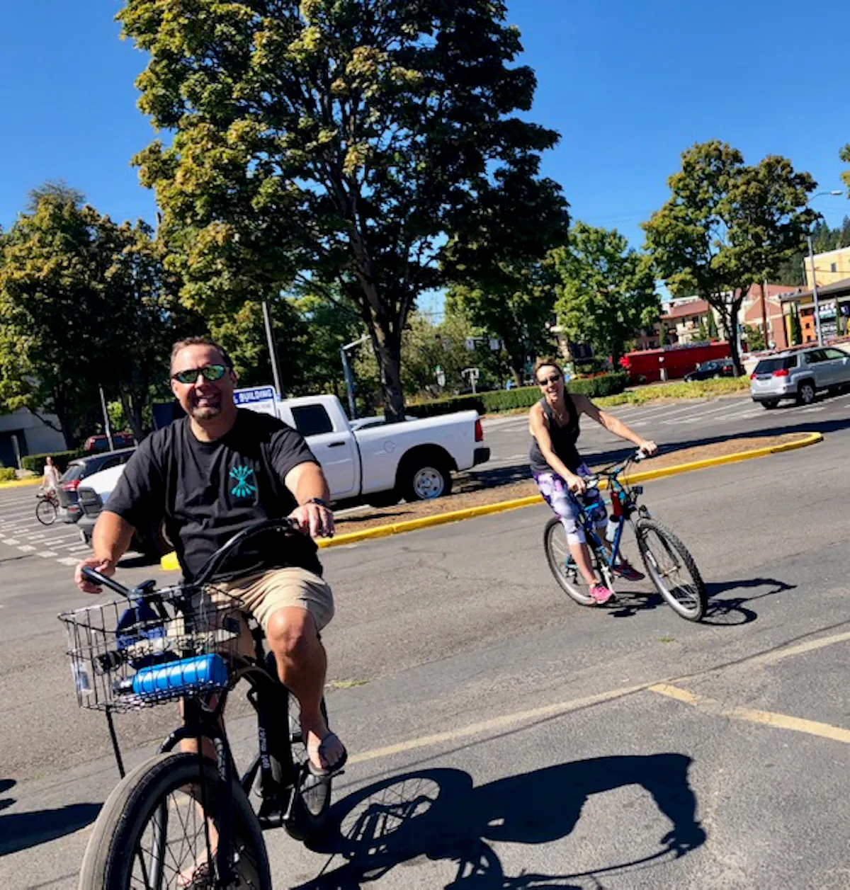 a man riding a bicycle in a parking lot