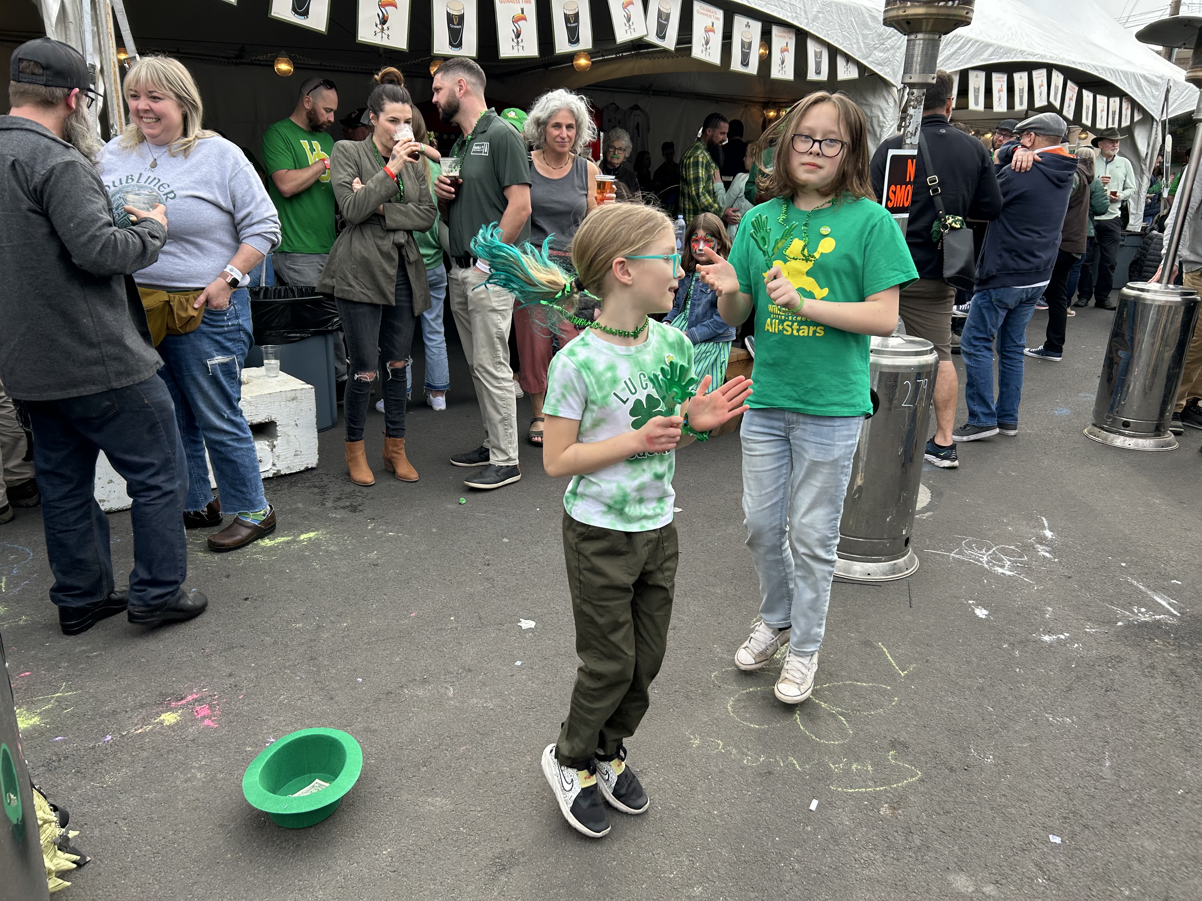 a group of people standing next to a child