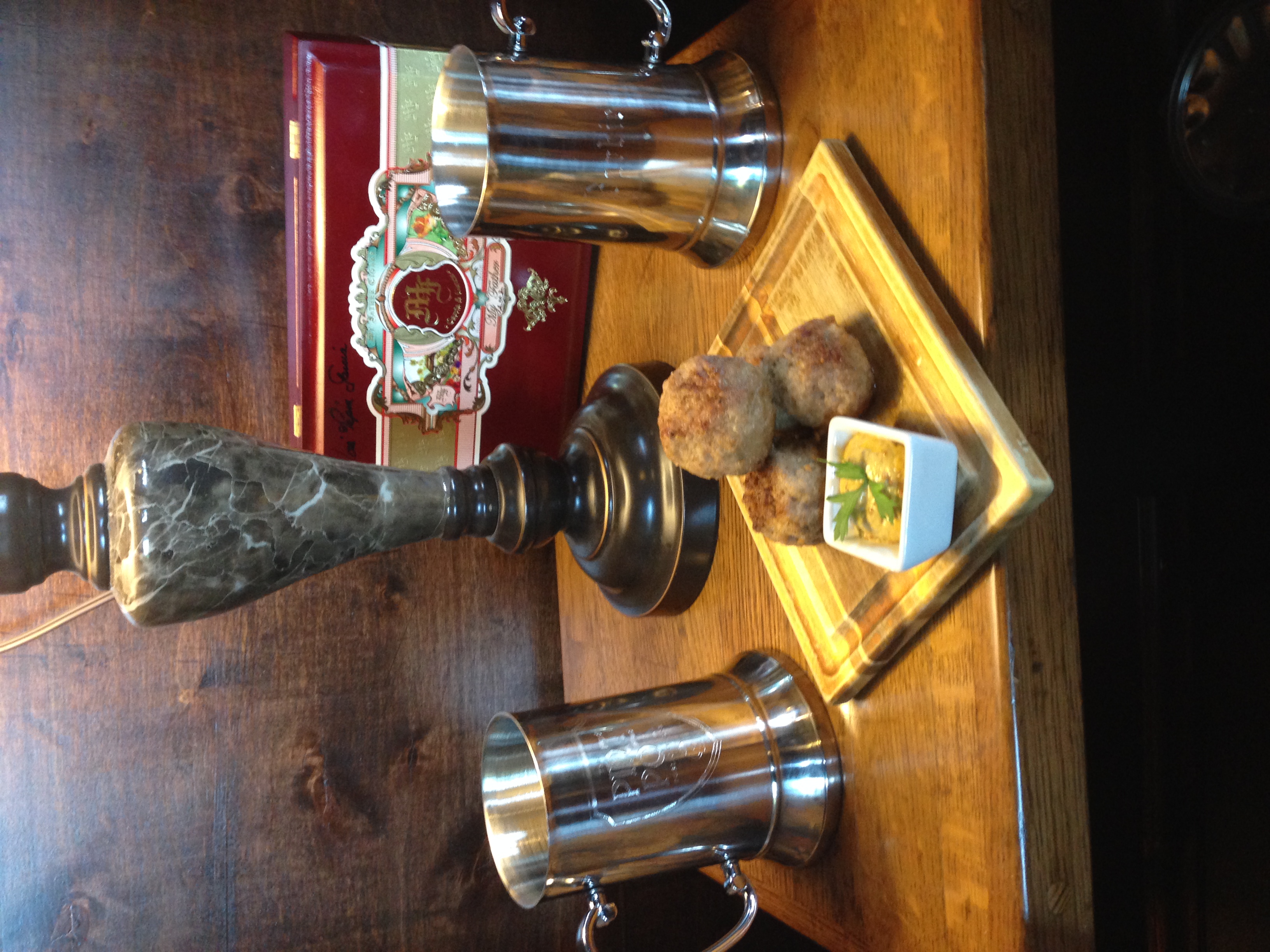 a vase sitting on top of a wooden table