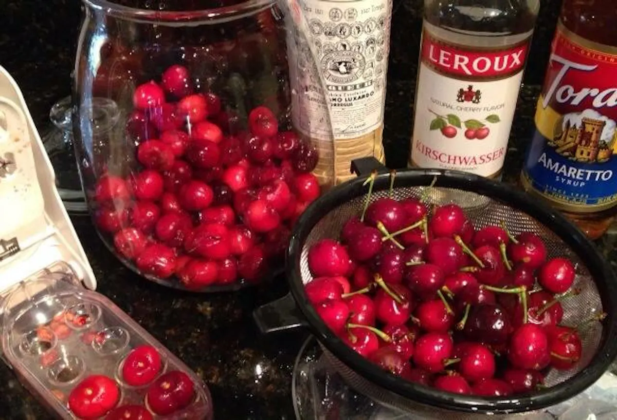a bottle of wine and a bowl of fruit