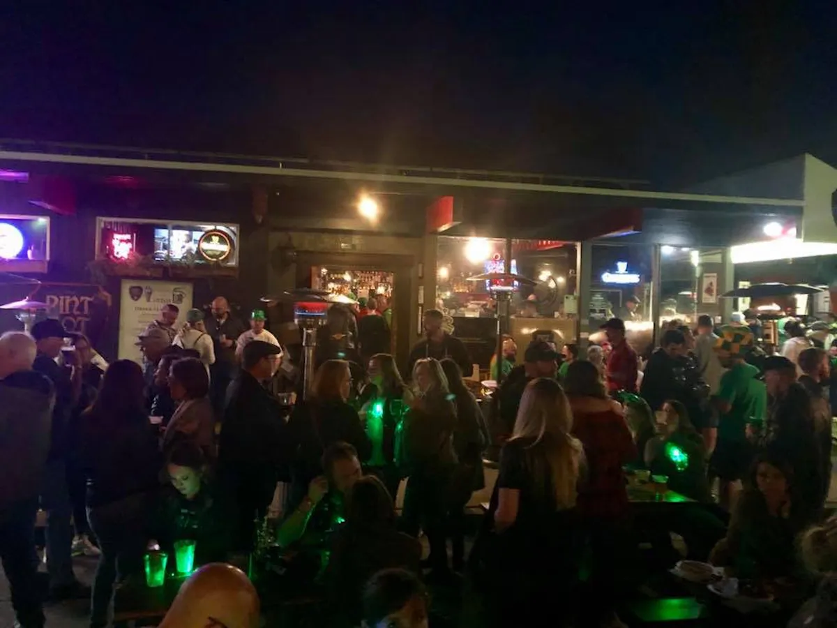 a group of people standing in front of a crowd