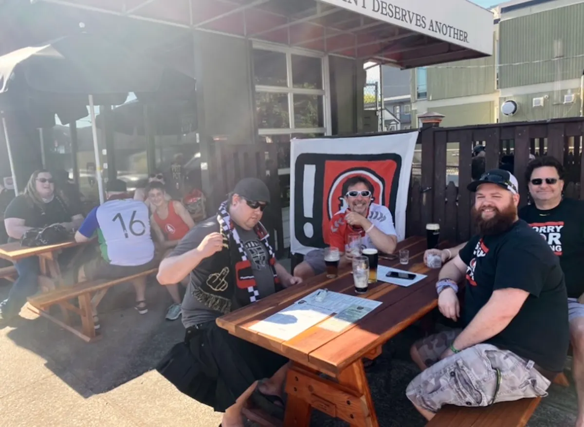 a group of people sitting at a table