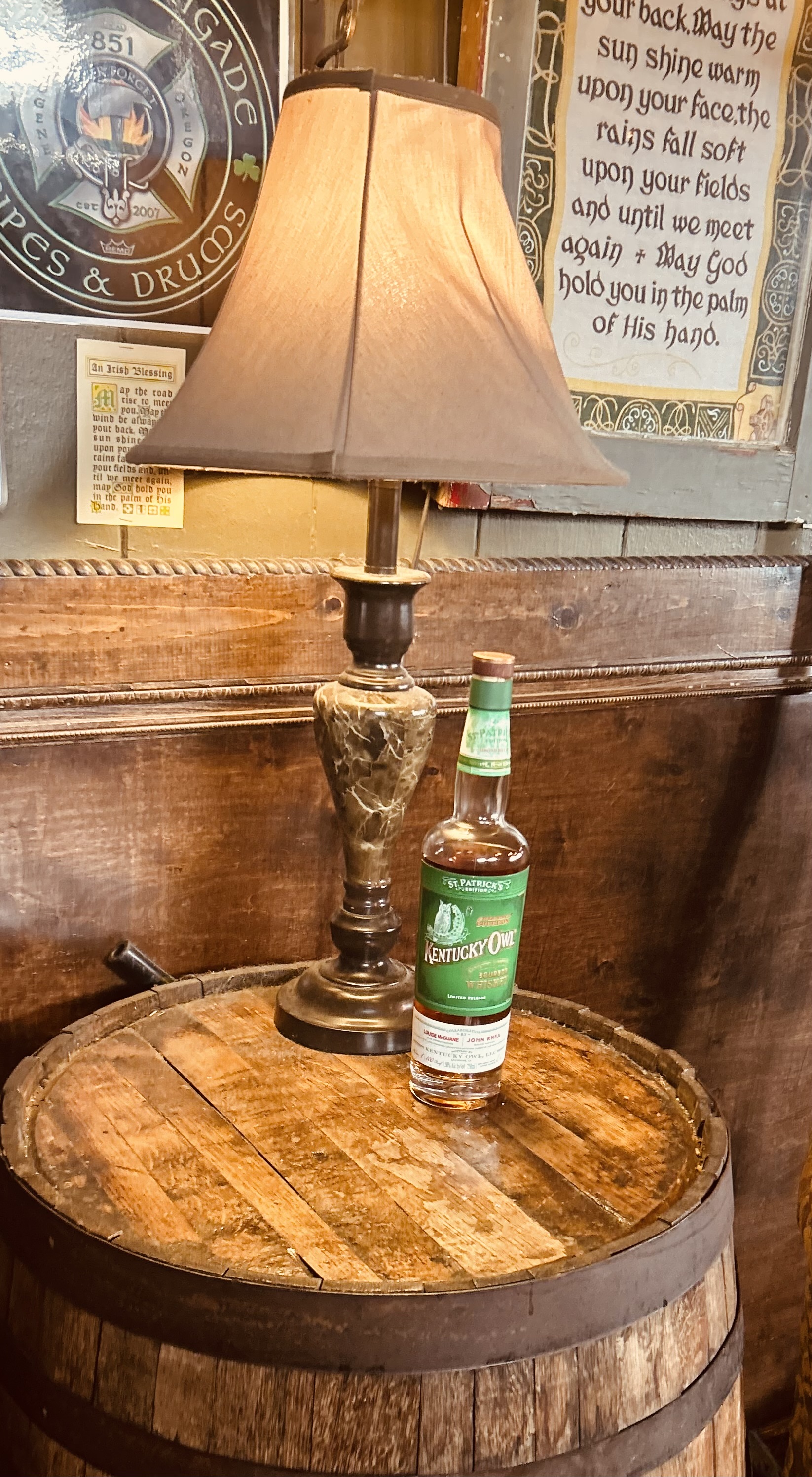 a bottle of wine sitting on top of a wooden table