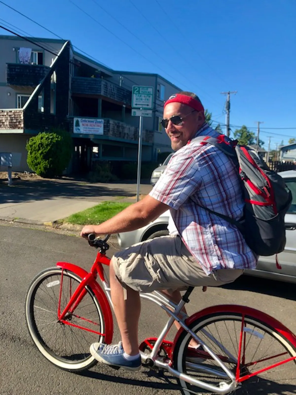 a man riding on the back of a bicycle