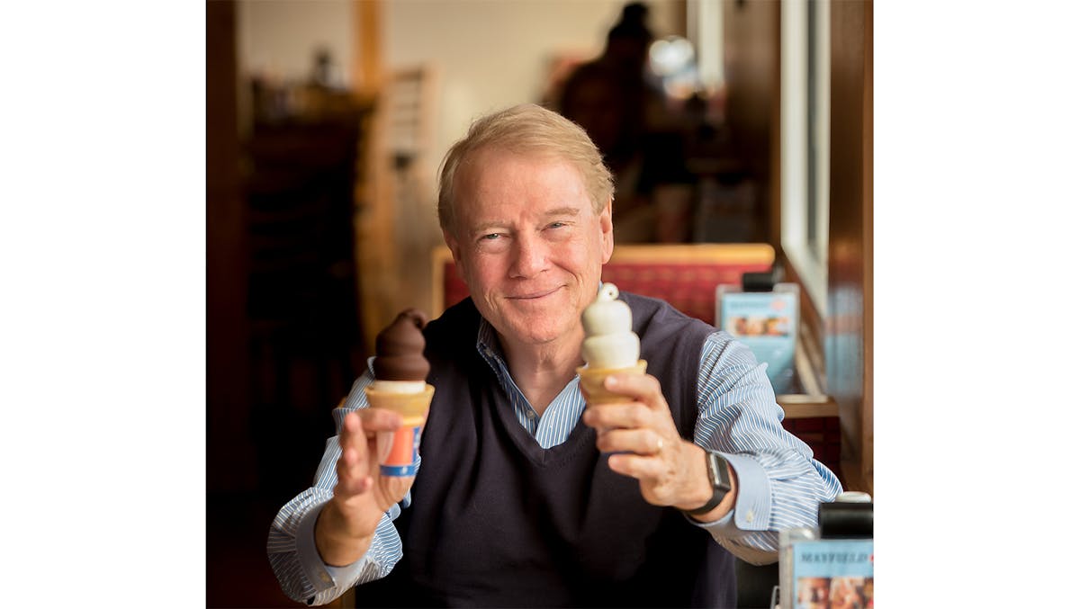 Robert Mayfield holding dipped cone and vanilla cone