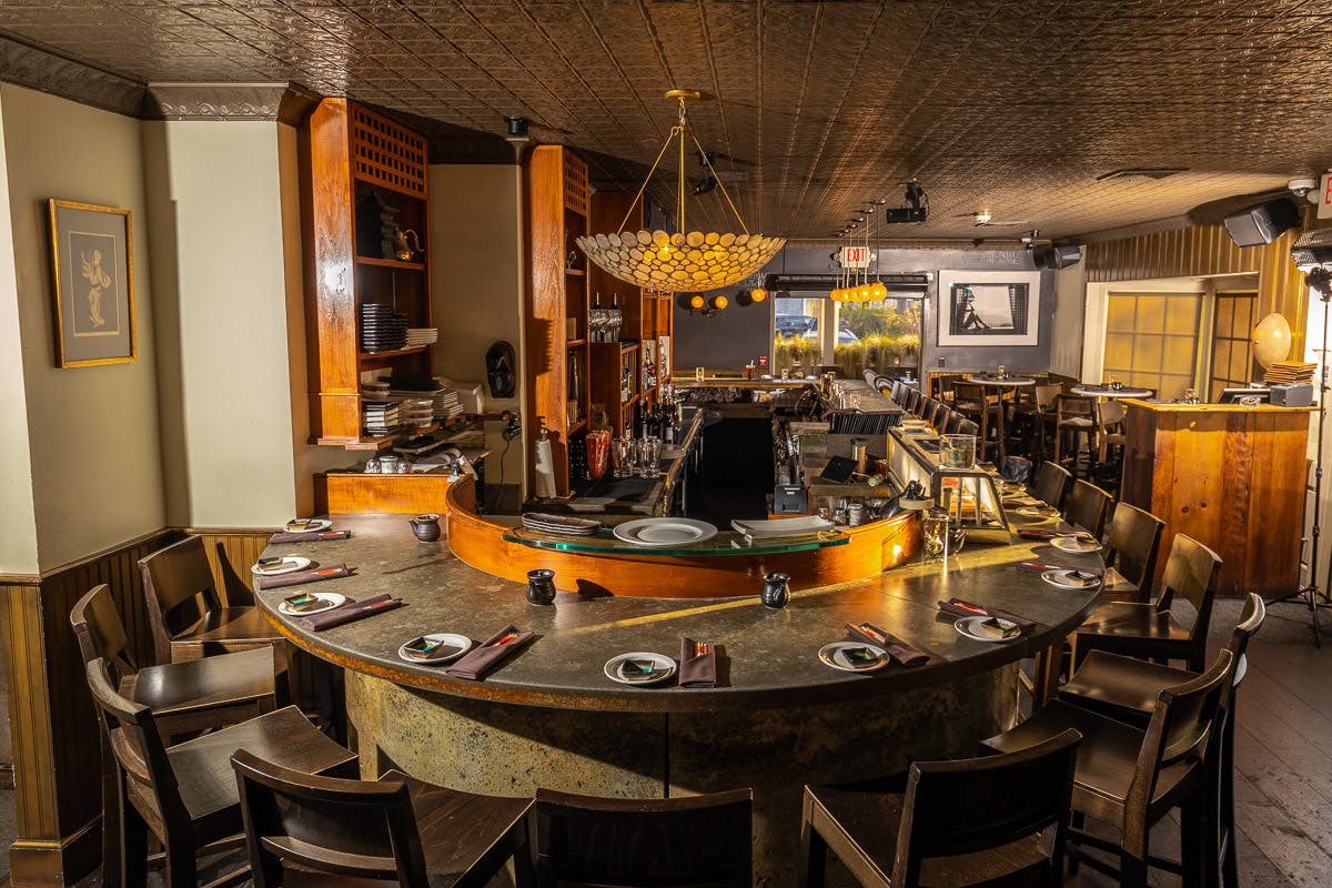 a kitchen with a table in a restaurant