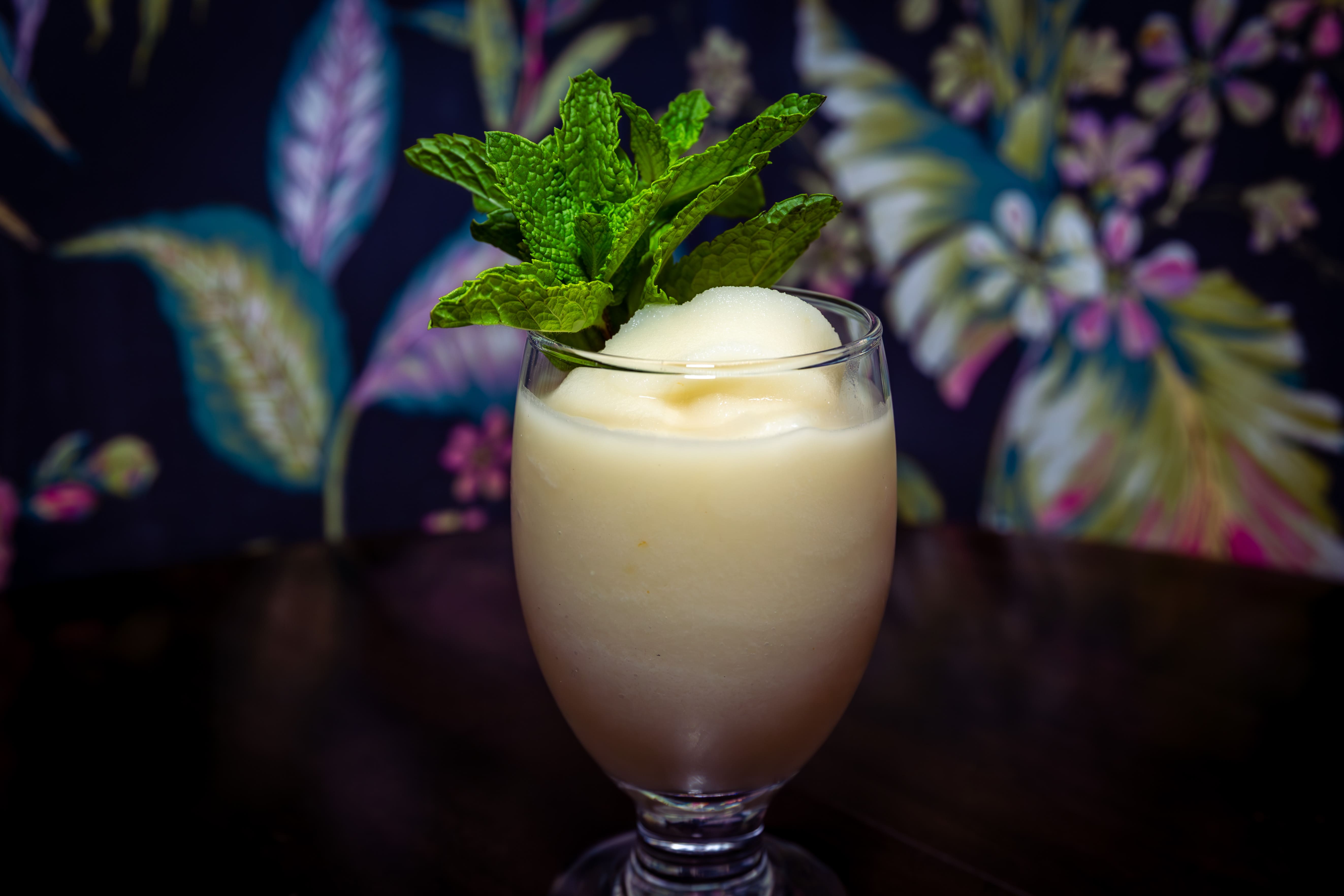 Light-colored cocktail with mint photographed for Starboard Tack