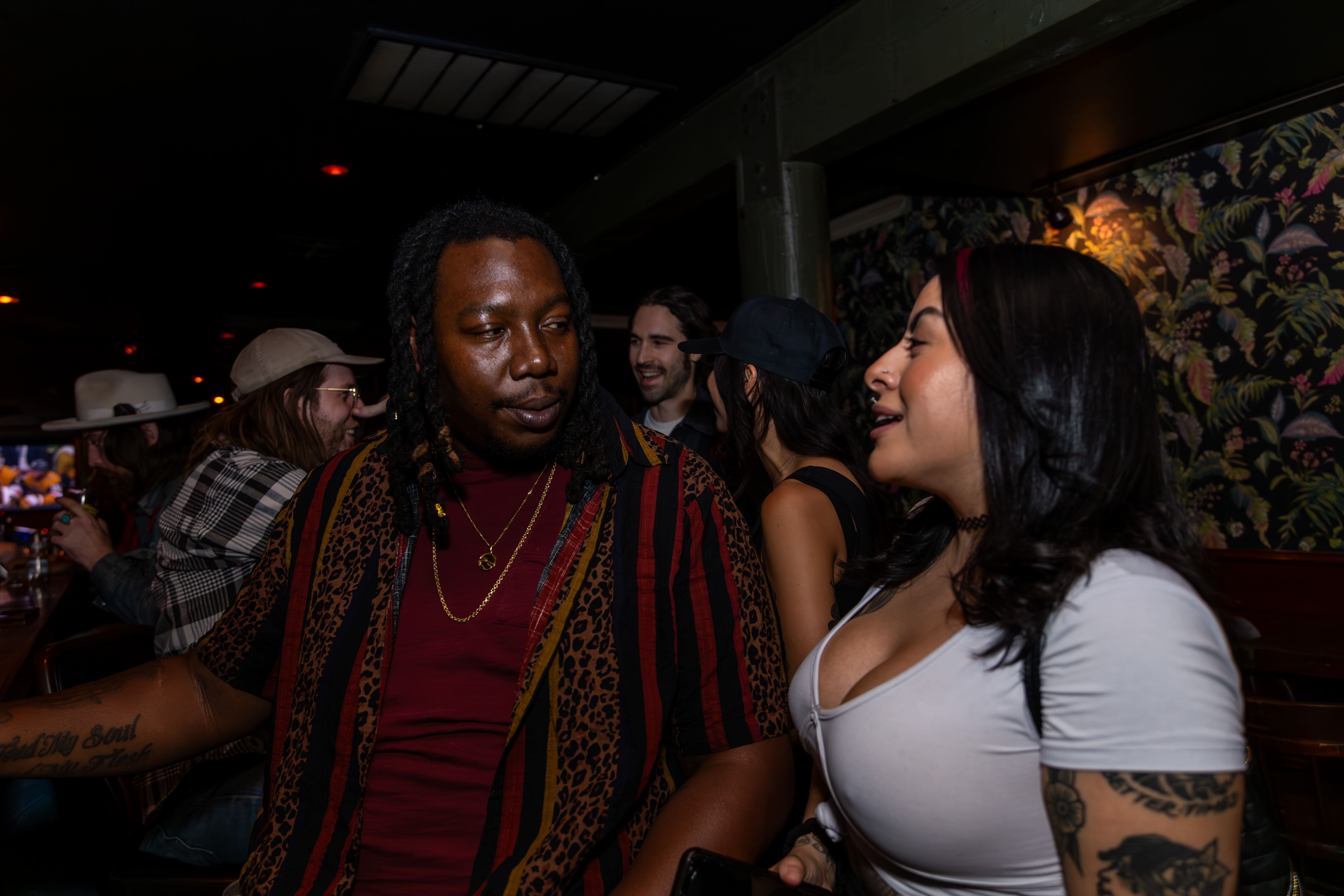 Adults talking during a social night at Starboard Tack