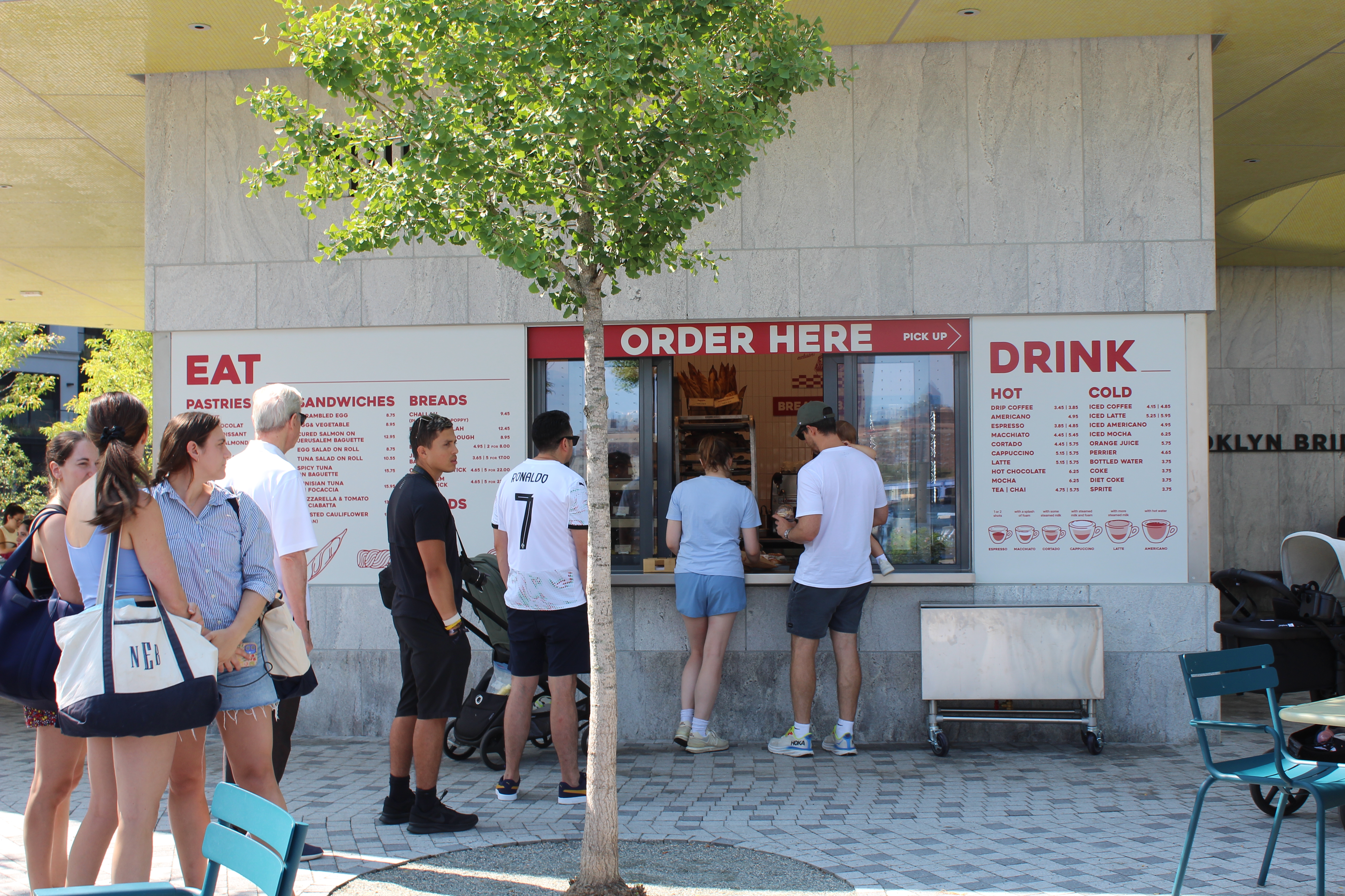 a group of people standing in front of a building