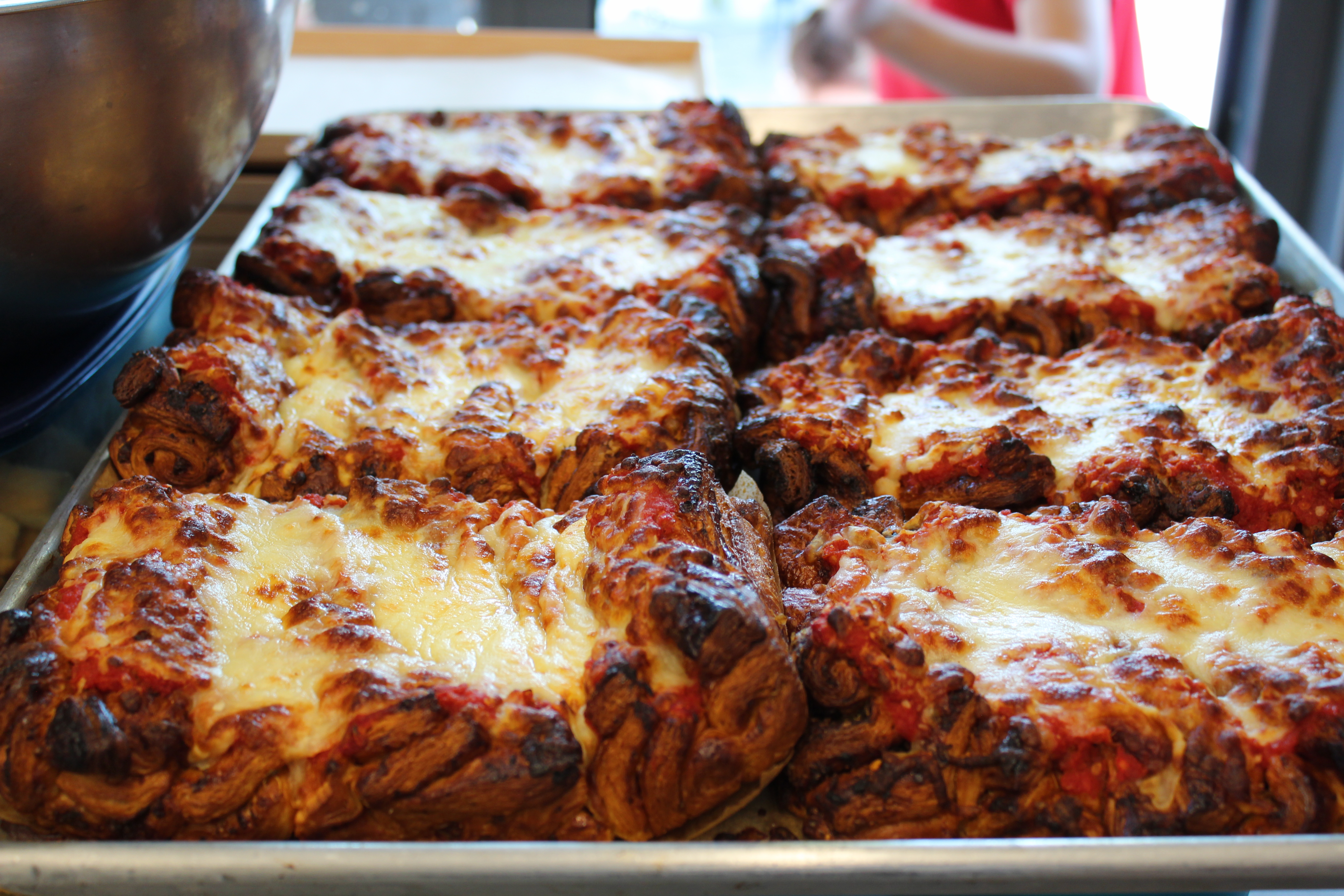 a slice of pizza on a tray