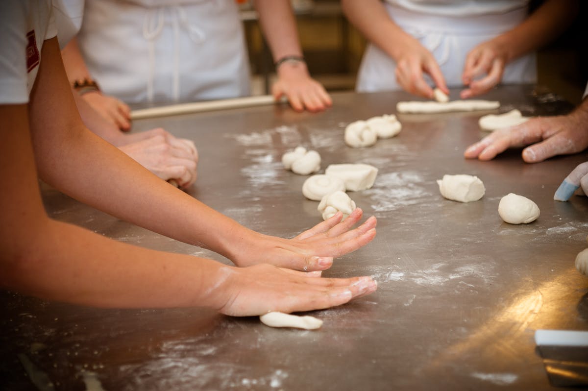 a group of people sitting on a cutting board
