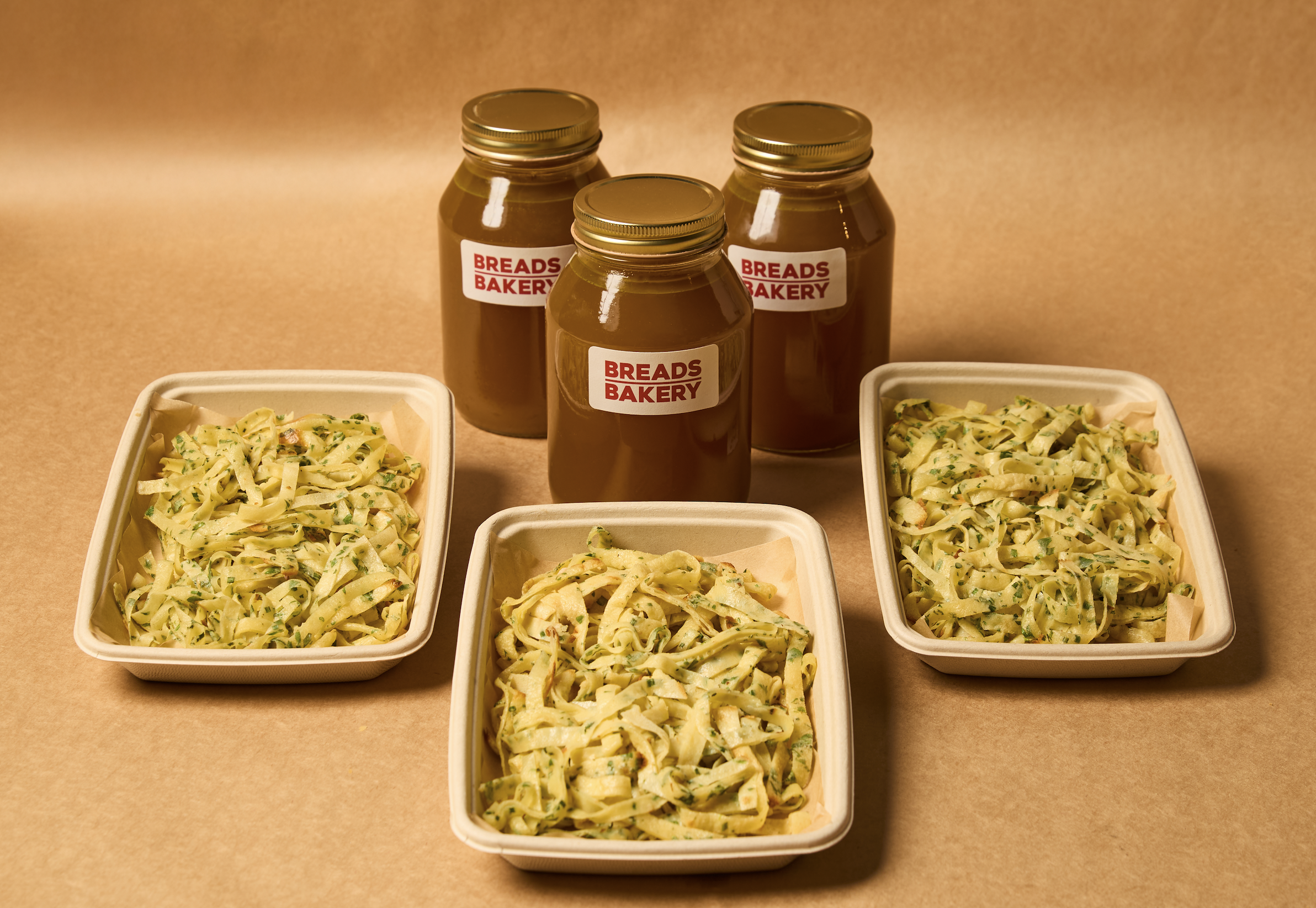 a close up of a bowl of noodles with sauce