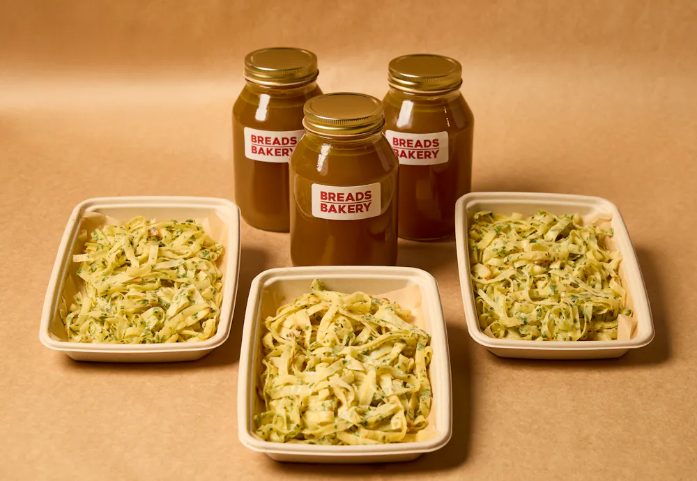 a close up of a bowl of noodles with sauce