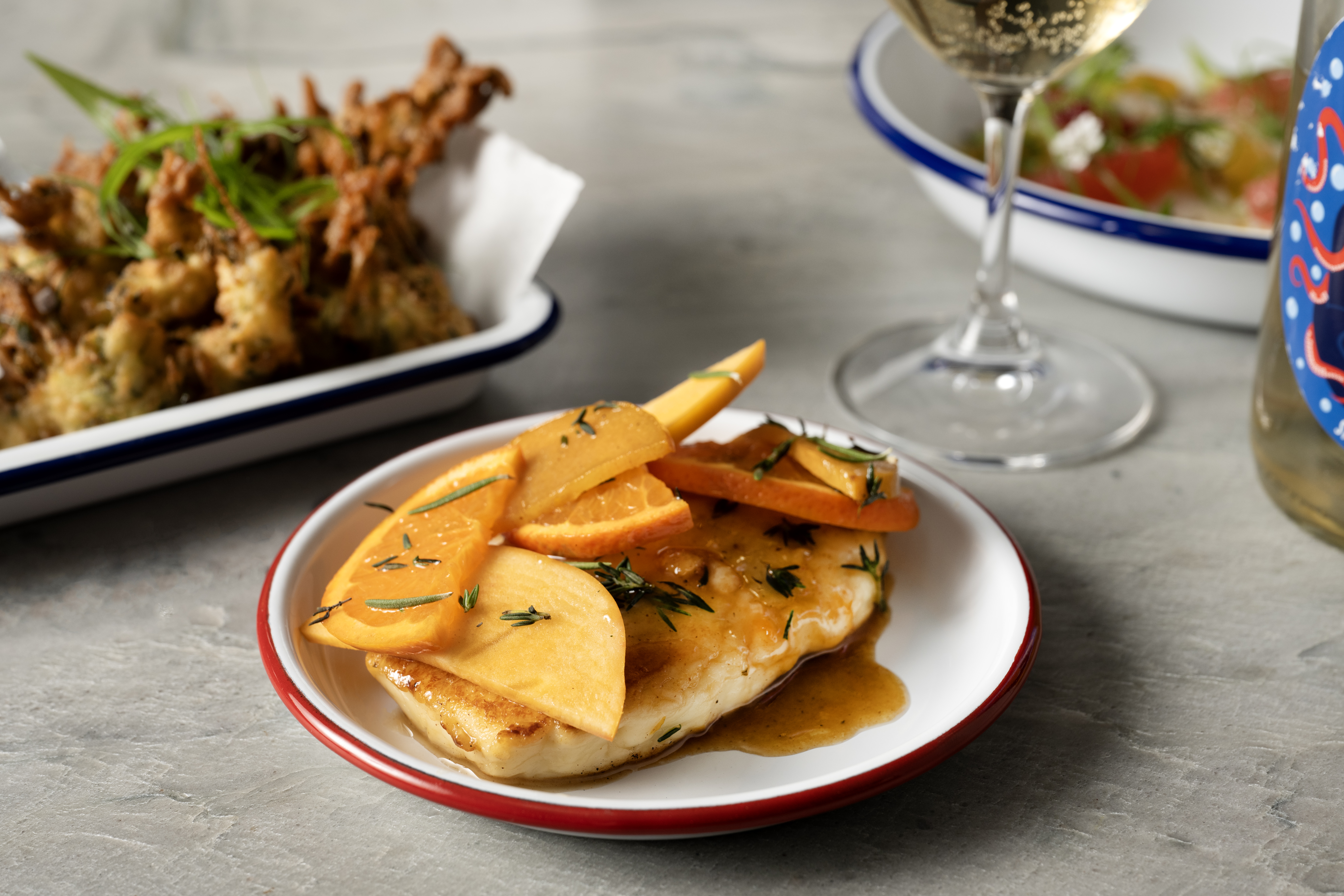 a bowl of food on a plate on a table