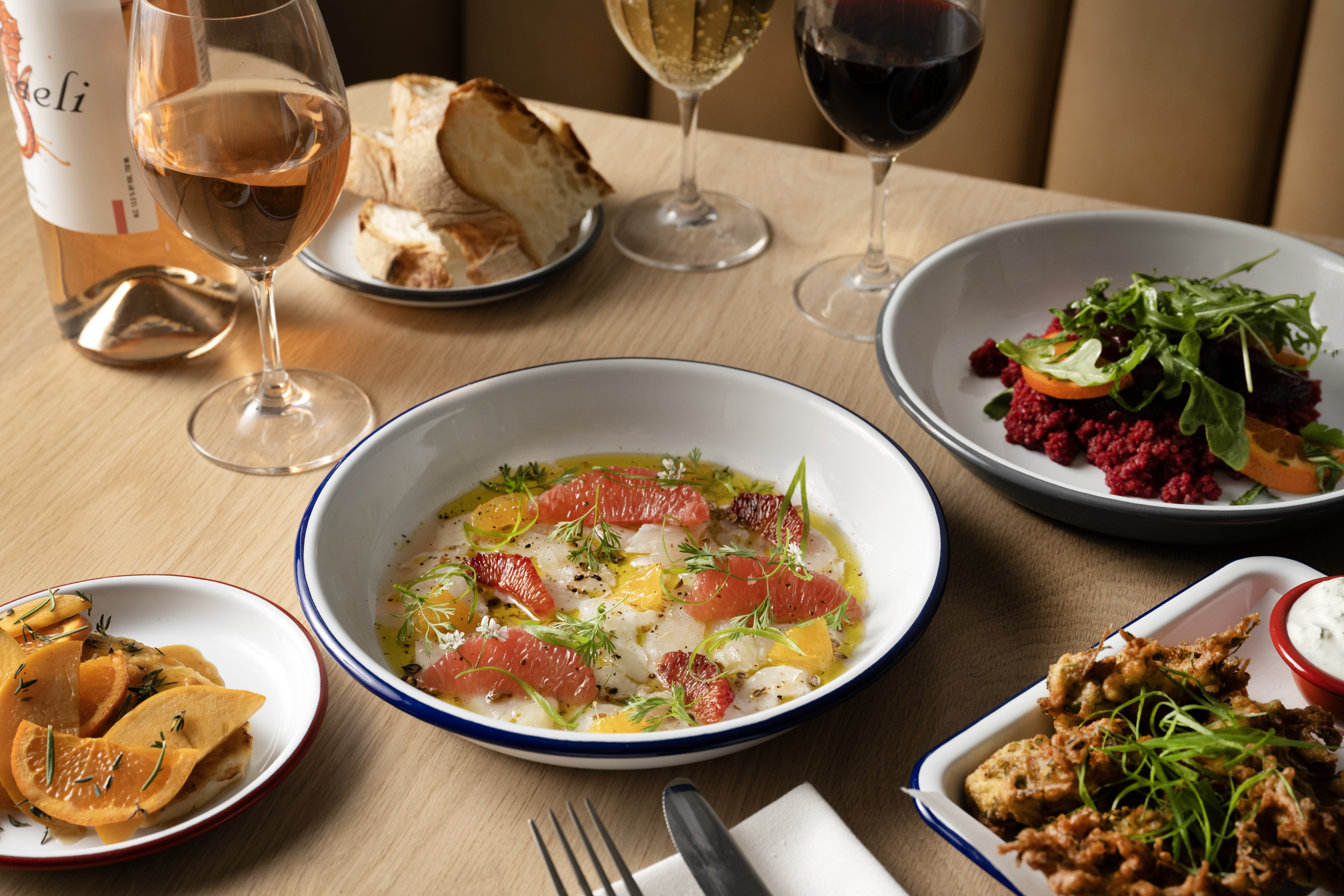 a bowl of food on a plate on a table