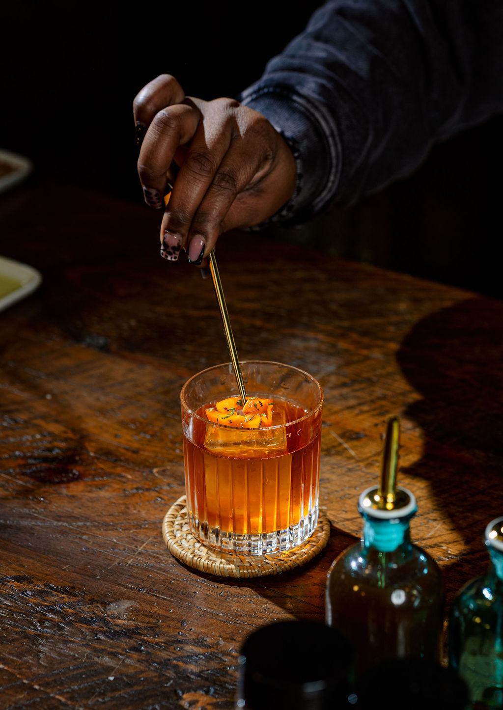 a man standing on top of a wooden table
