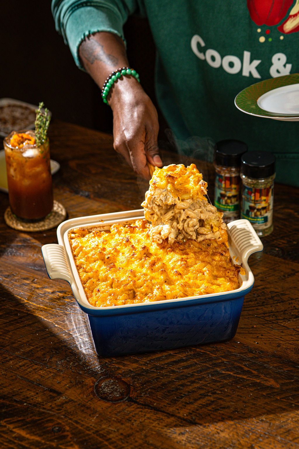 a person sitting at a table with a plate of food