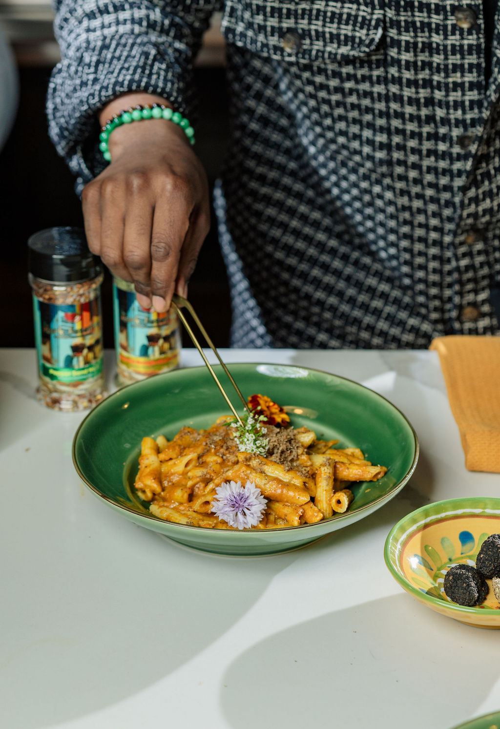 a person sitting at a table with a plate of food