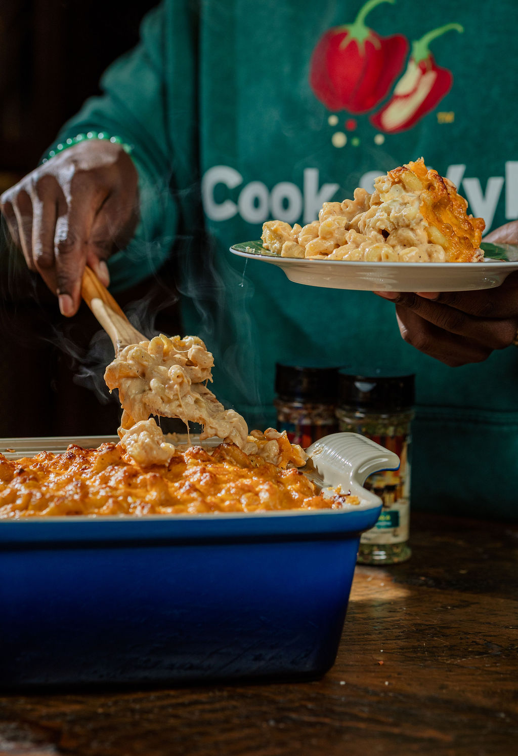 a person sitting at a table with a plate of food