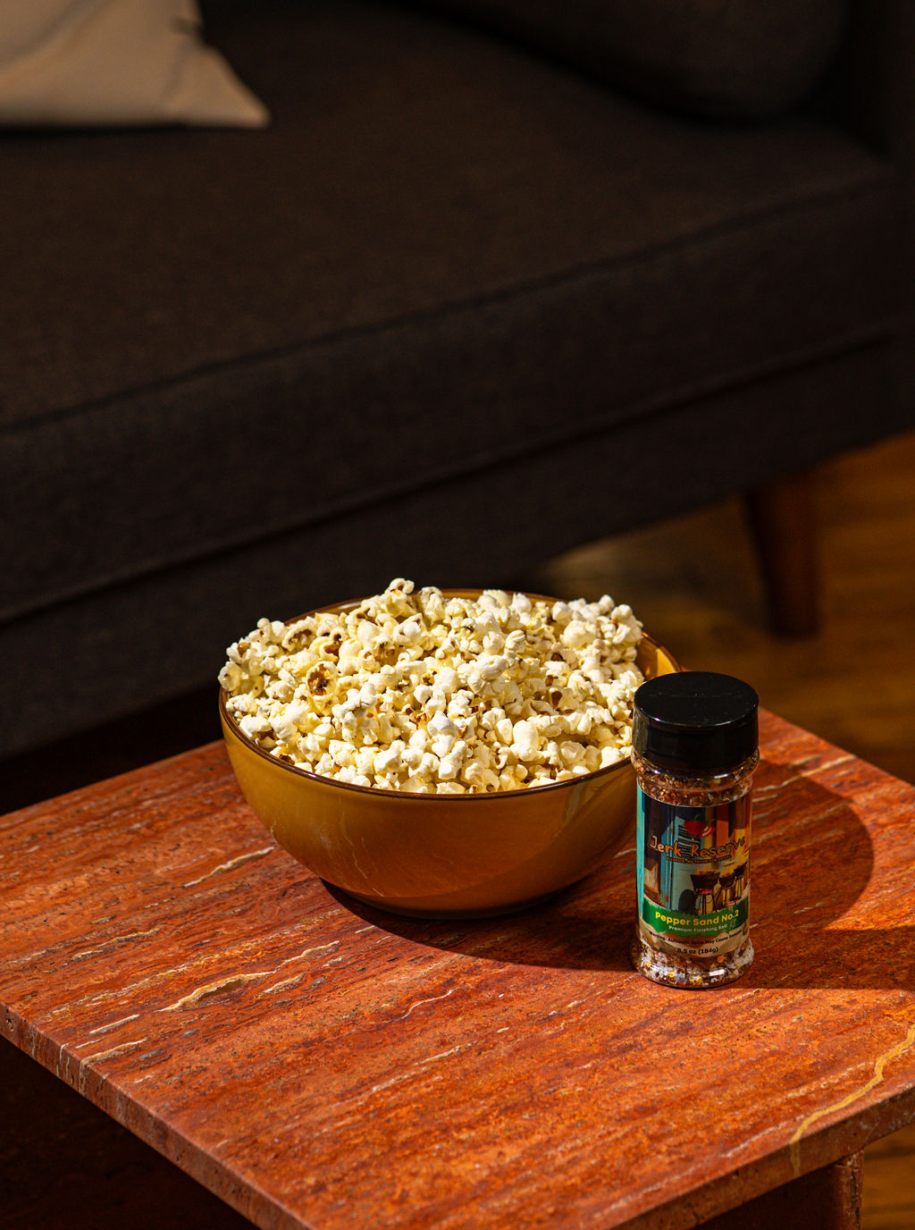 a vase of flowers sitting on top of a wooden table