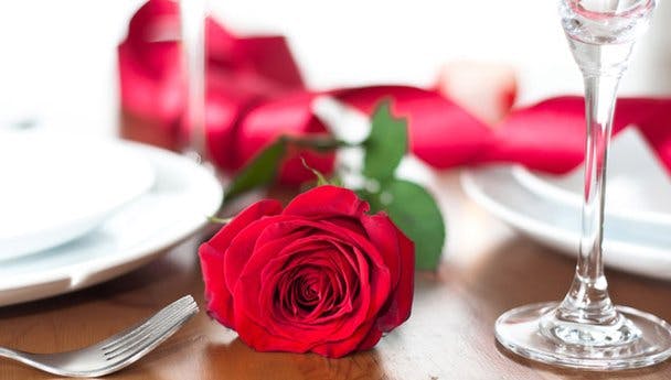 a close up of a wine glass on a table