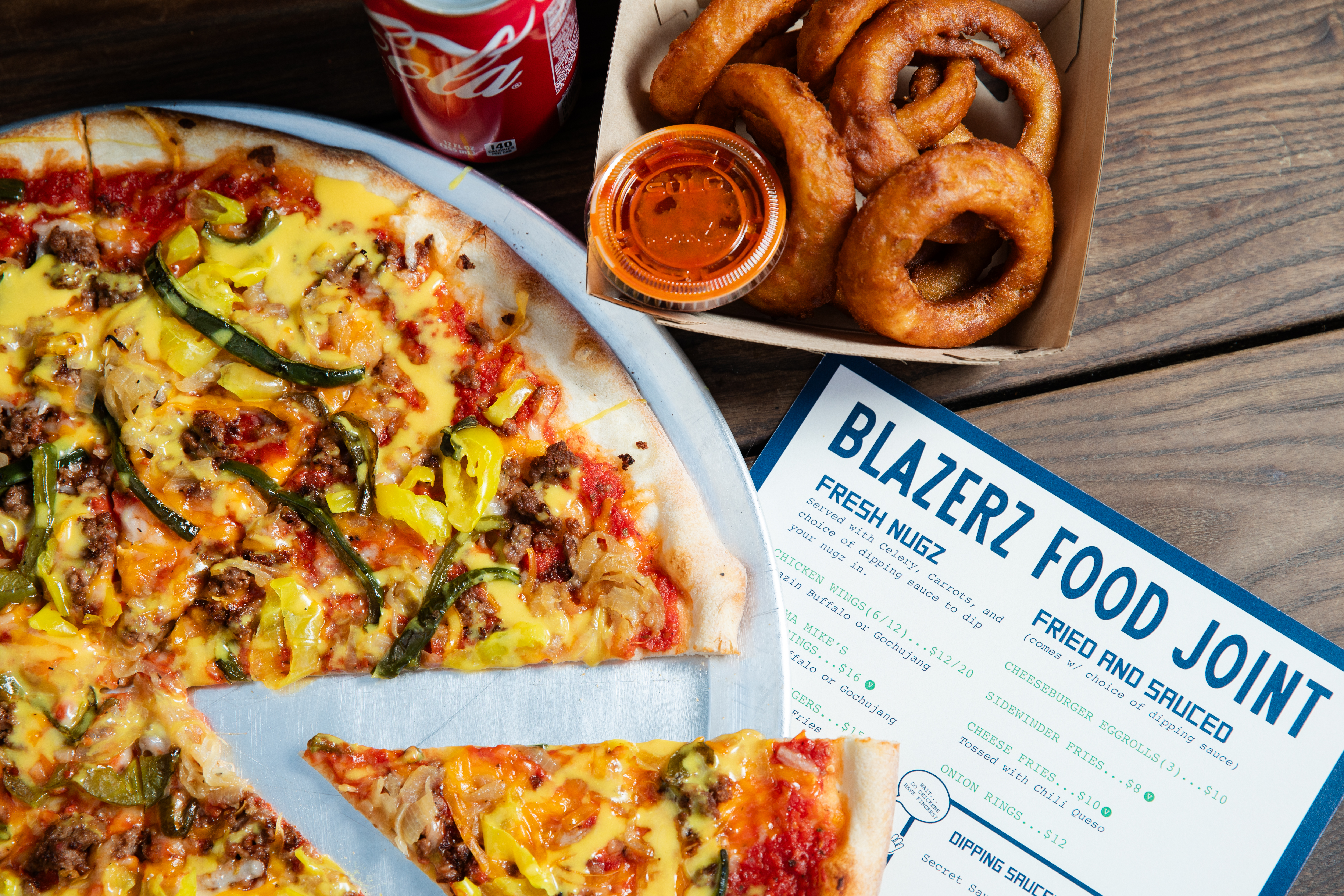 a pizza sitting on top of a plate of food