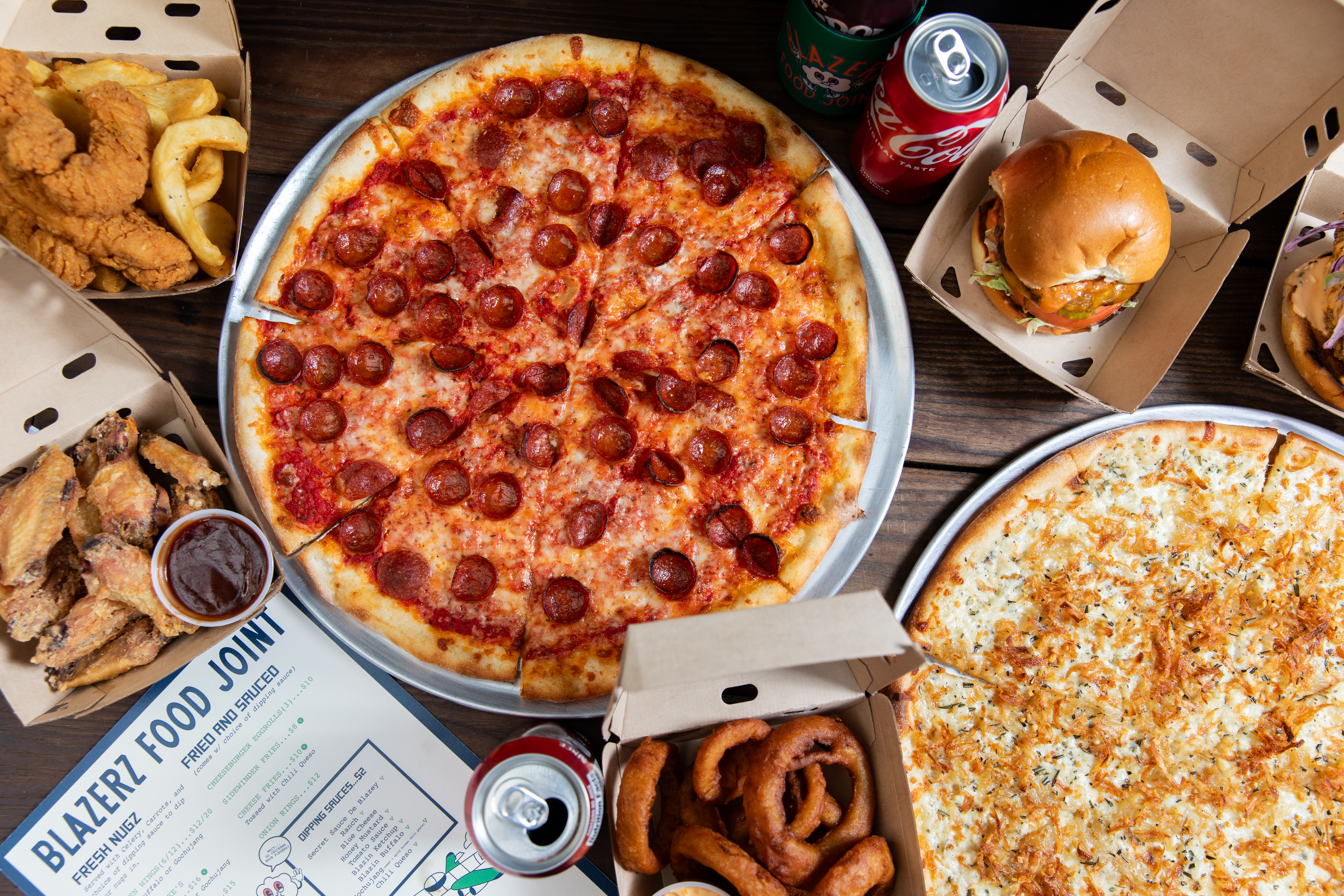 a box filled with different types of pizza sitting on top of a table
