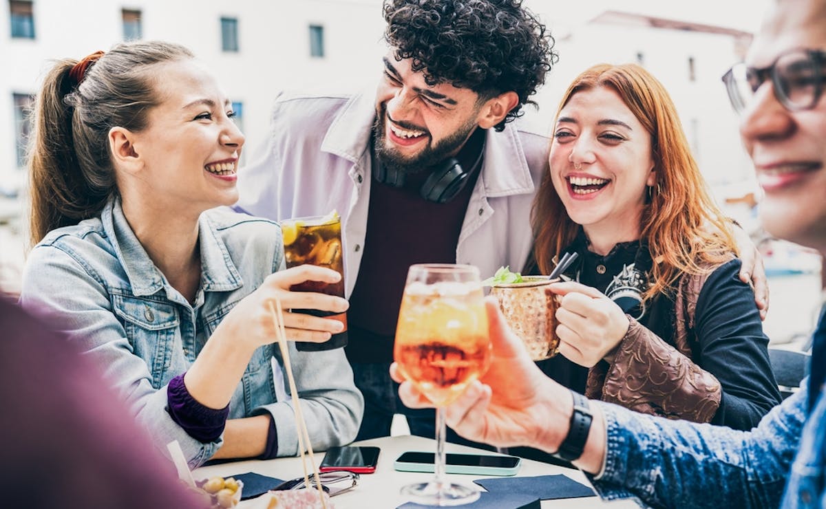 friends enjoying cocktails outside
