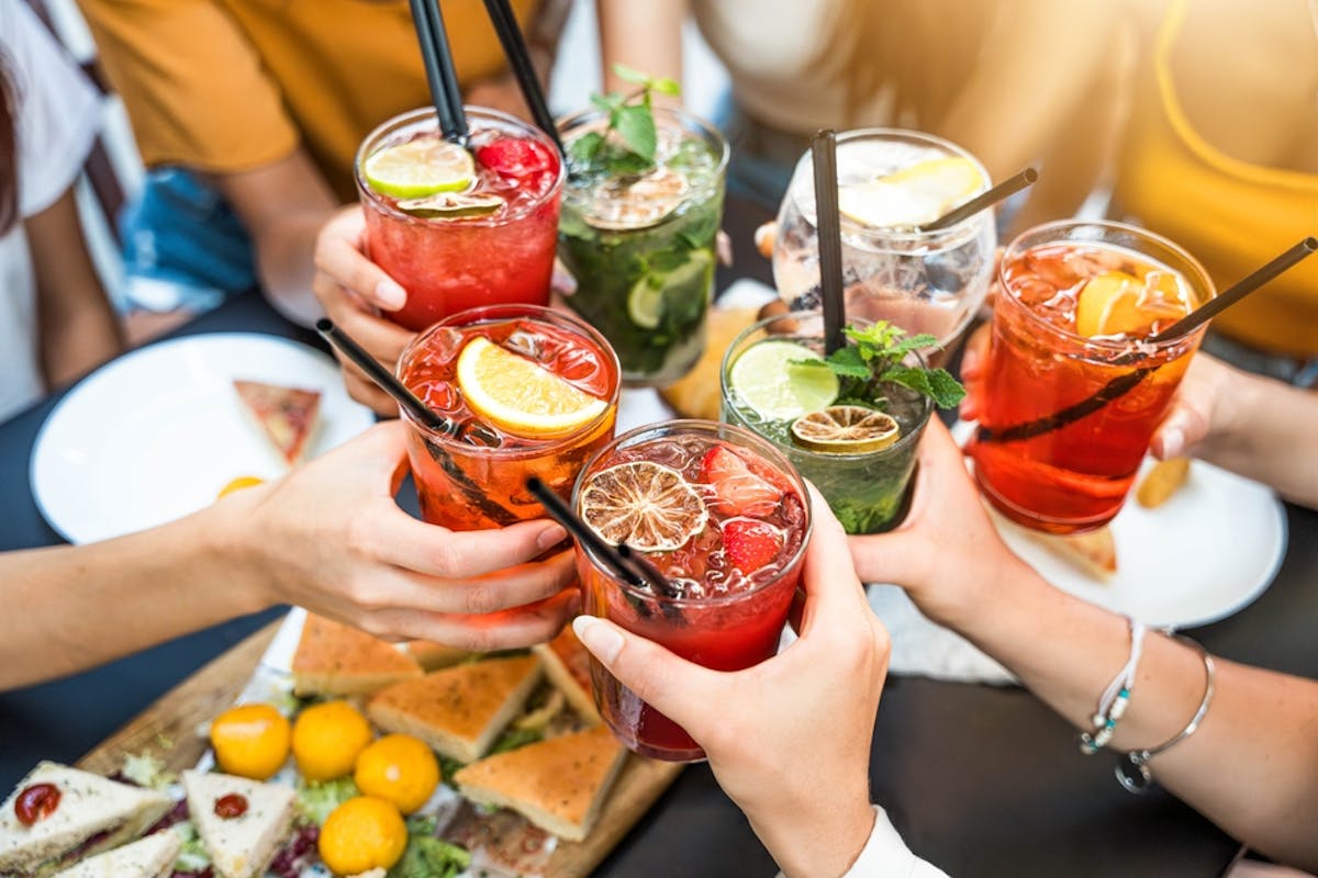 friends sharing cocktails