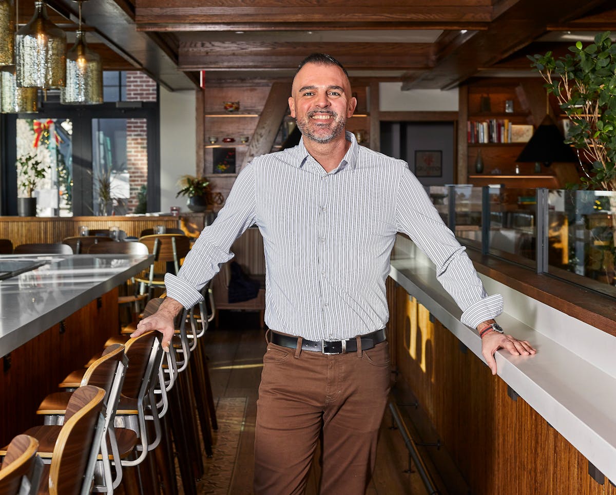 a man standing in front of a counter