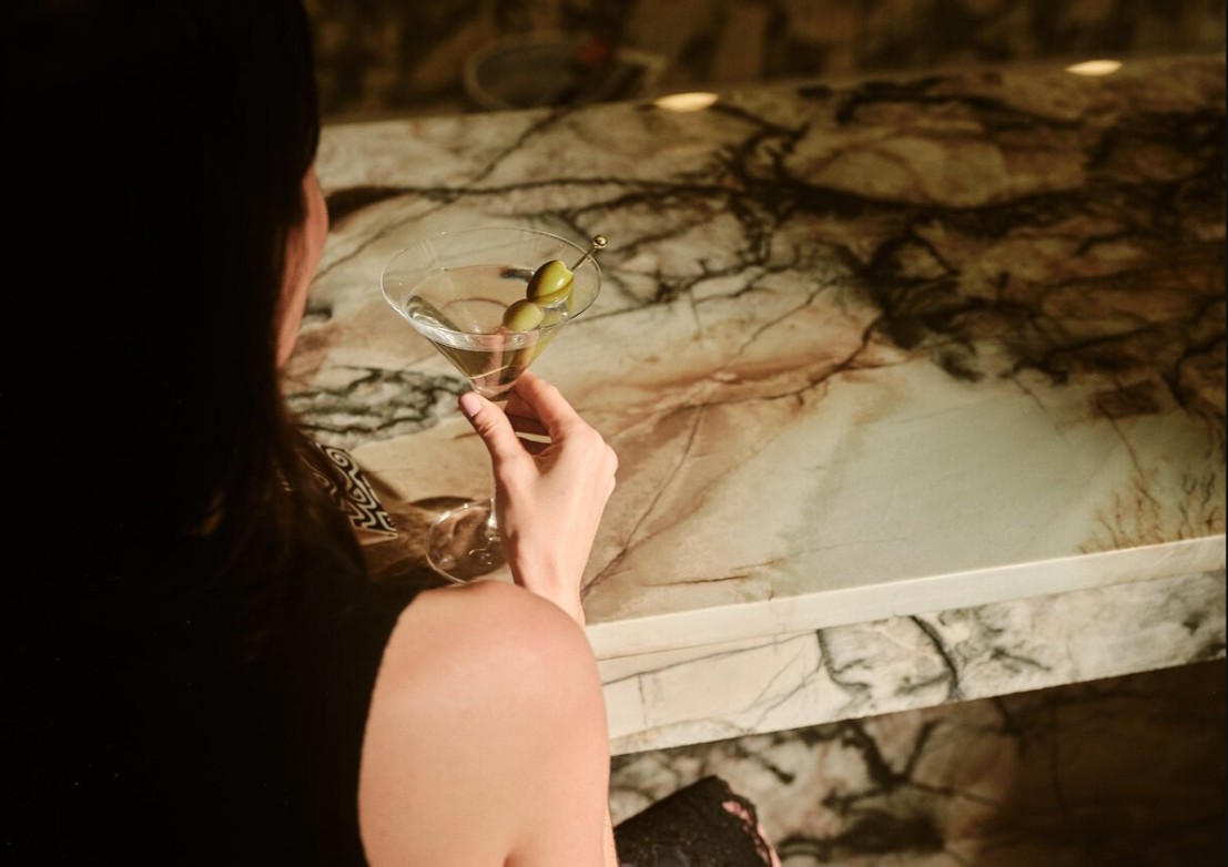 a woman sitting on a table